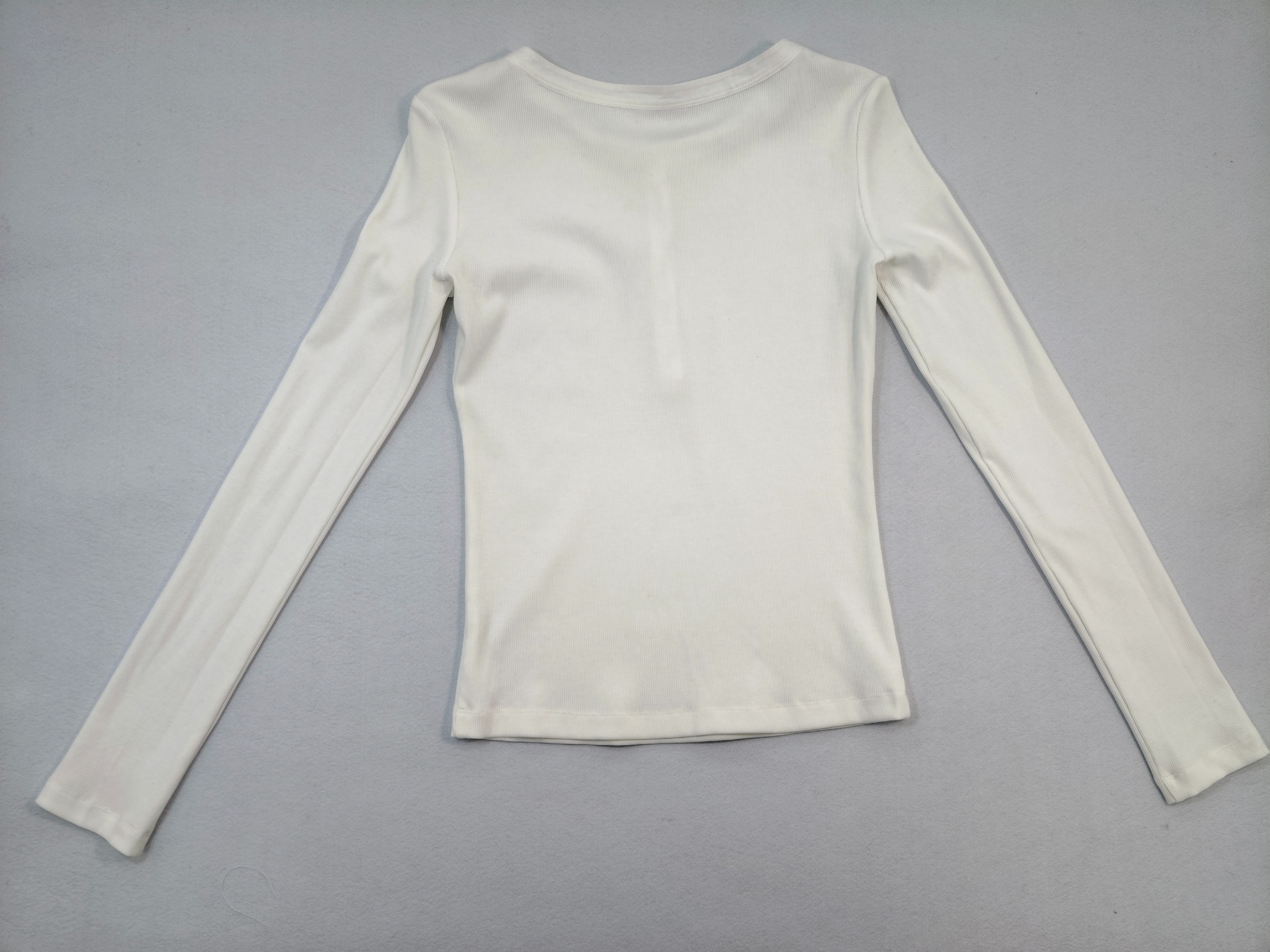 Back flat view showing fitted long-sleeve silhouette