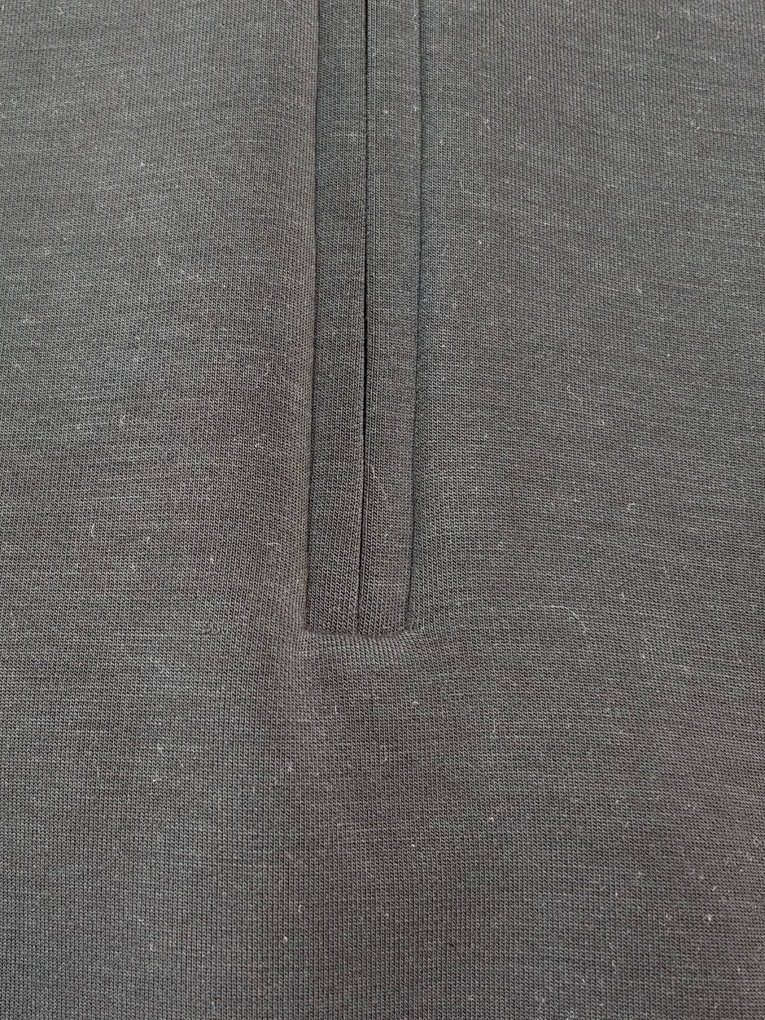 Half-zip placket and scuba seam stitching close-up