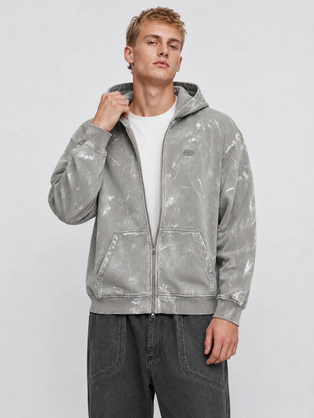 Model wearing washed grey recycled cotton zip hoodie