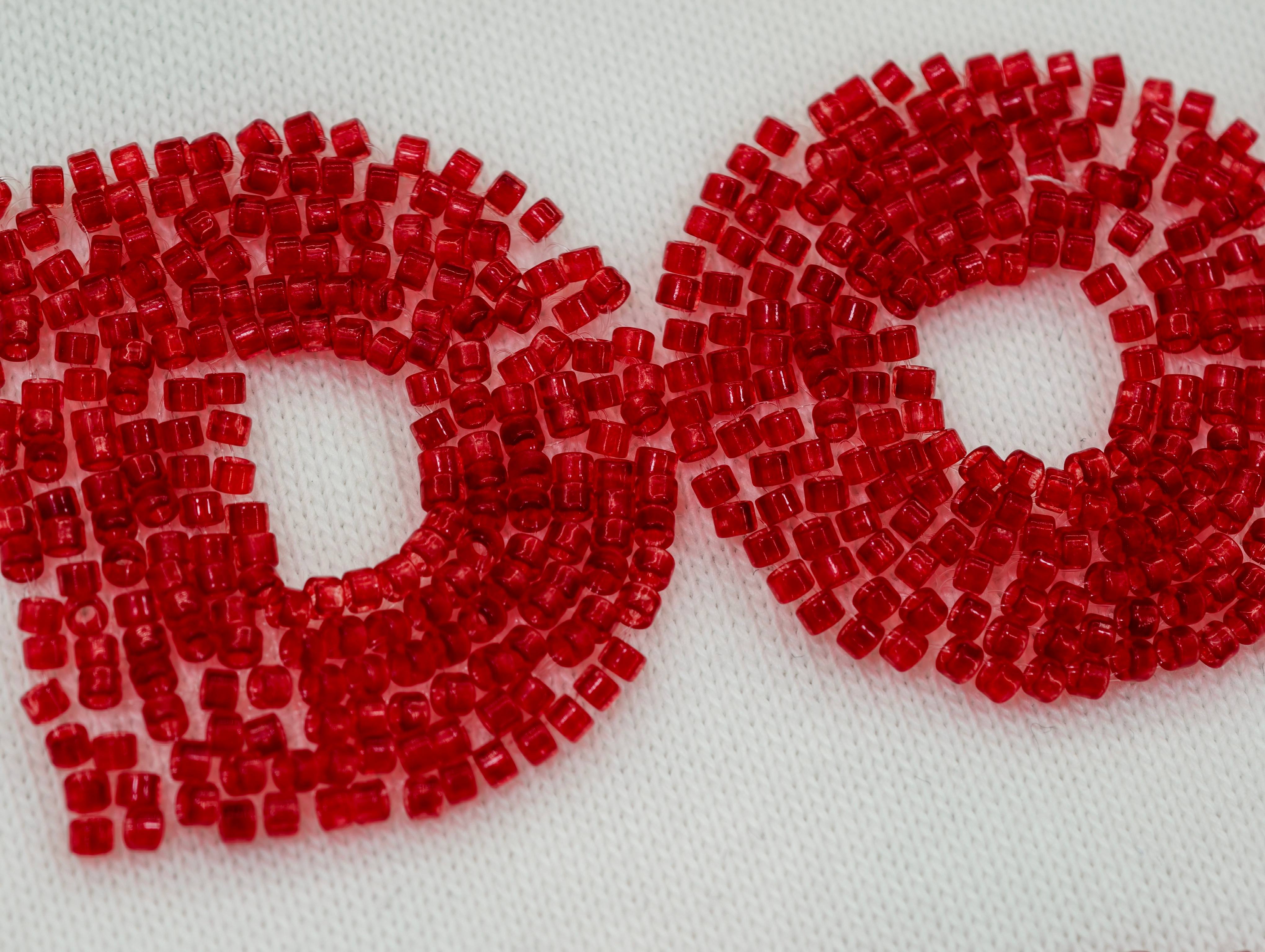 Red tube bead embellished slogan on chest detail