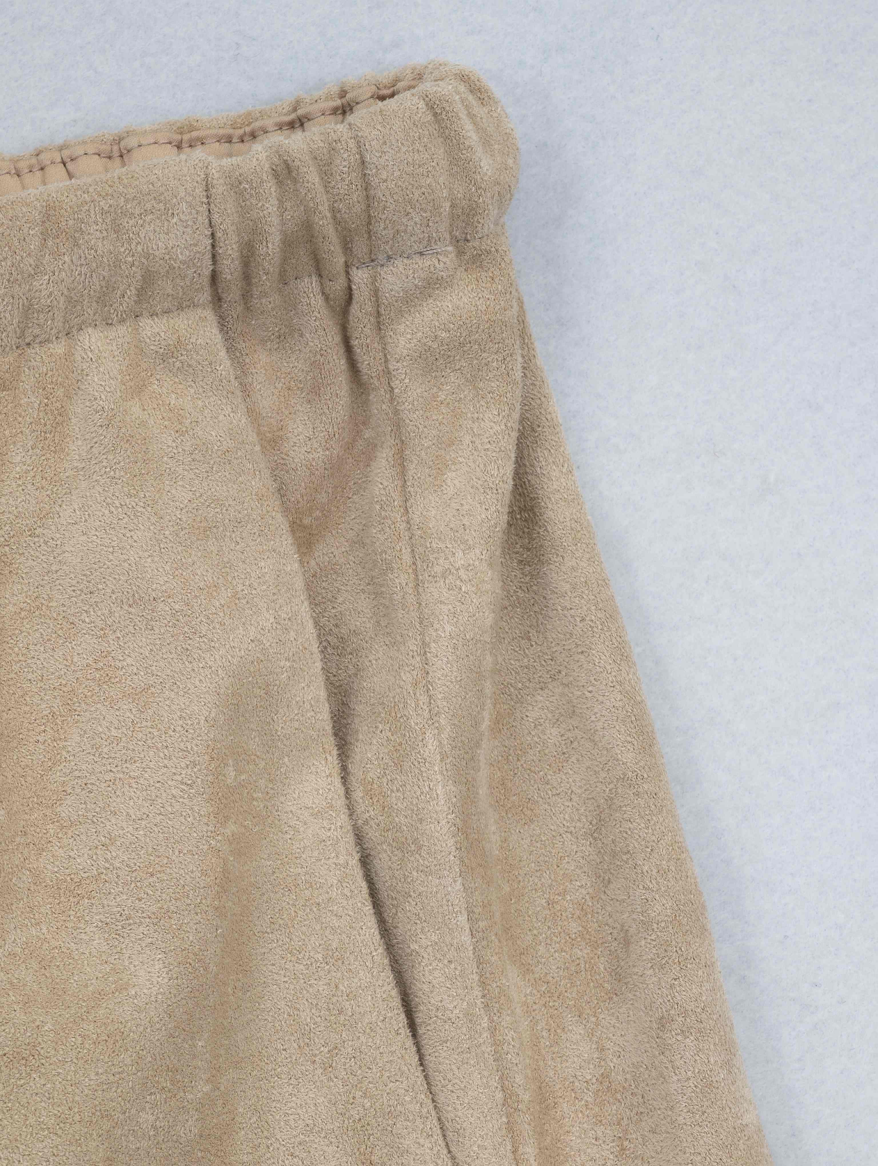 Side pocket and vertical seam detail on brushed pants