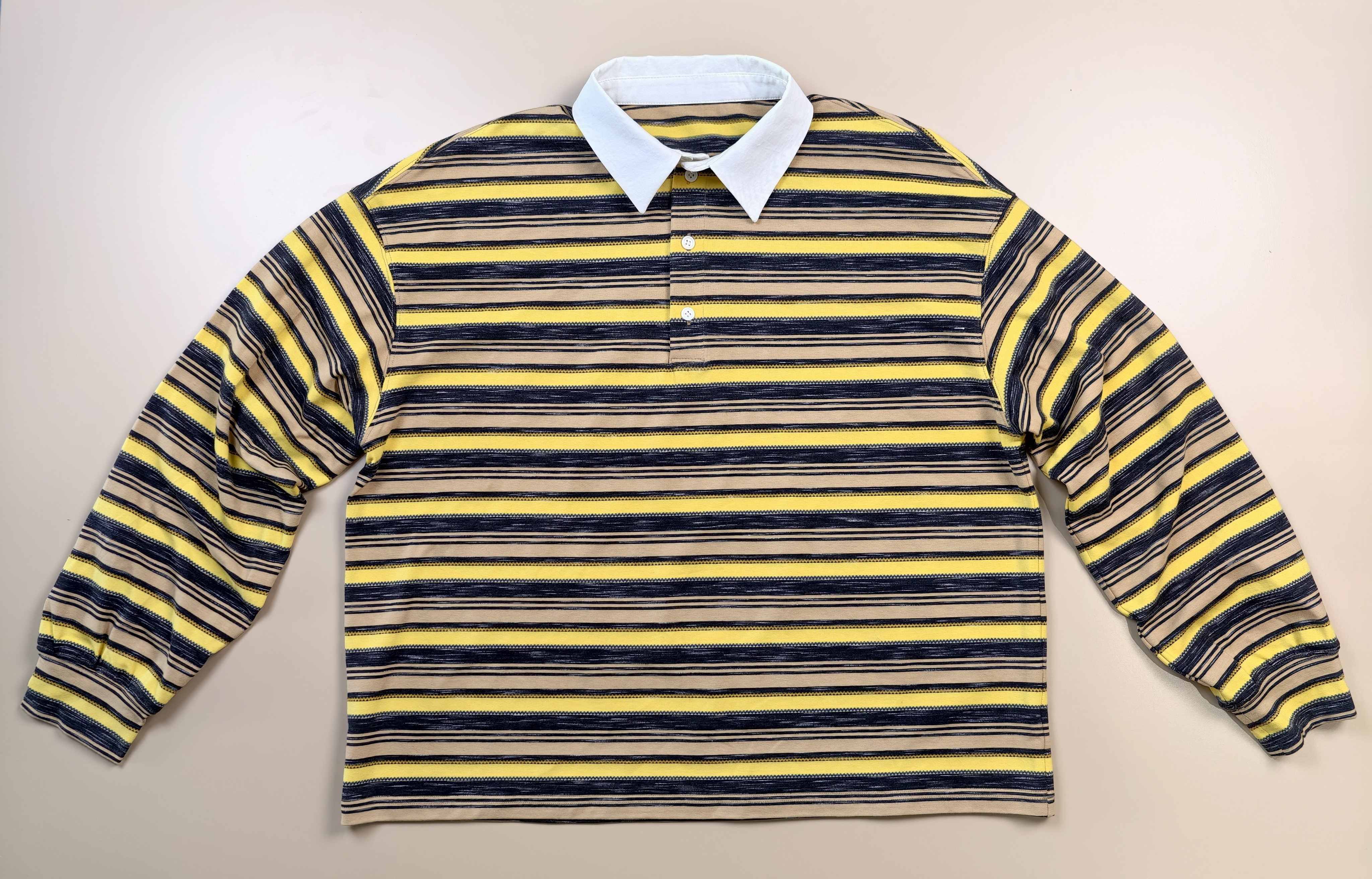 Flat front view with contrast collar and button placket