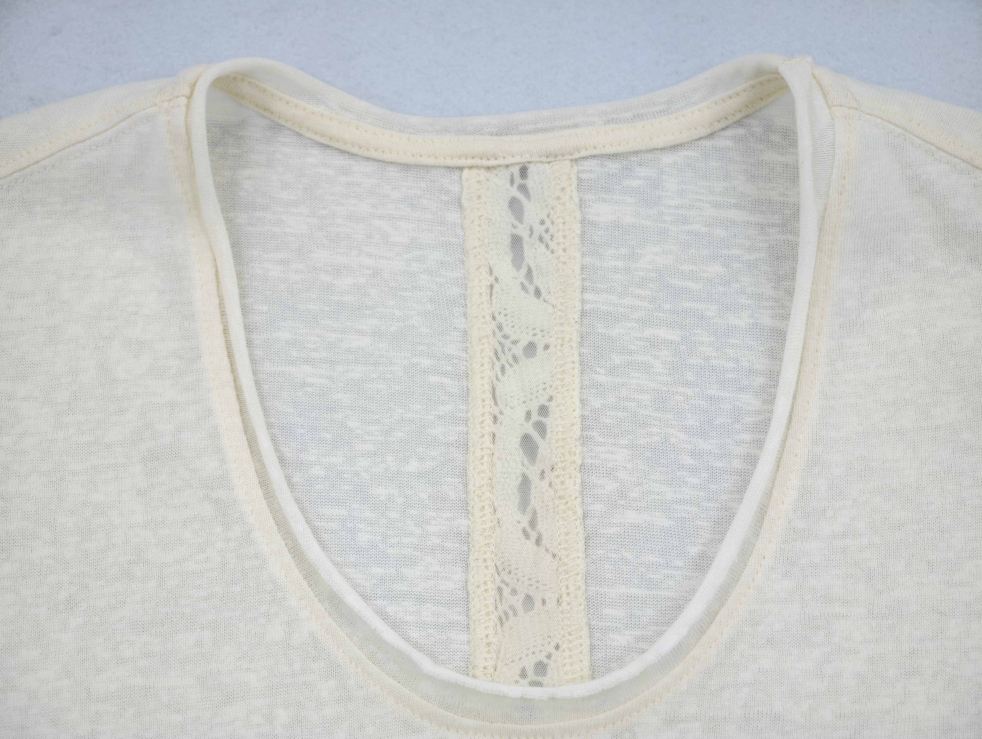 Bound neckline joined to delicate center-back lace panel