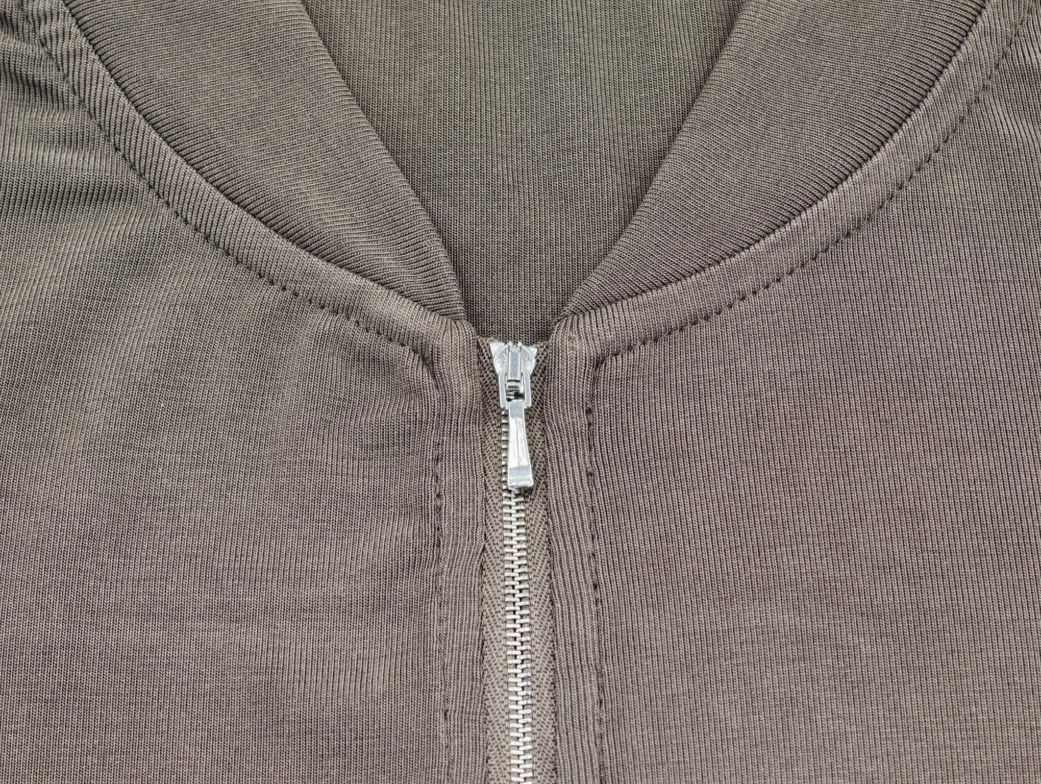 Full-zip neckline construction by an apparel producer