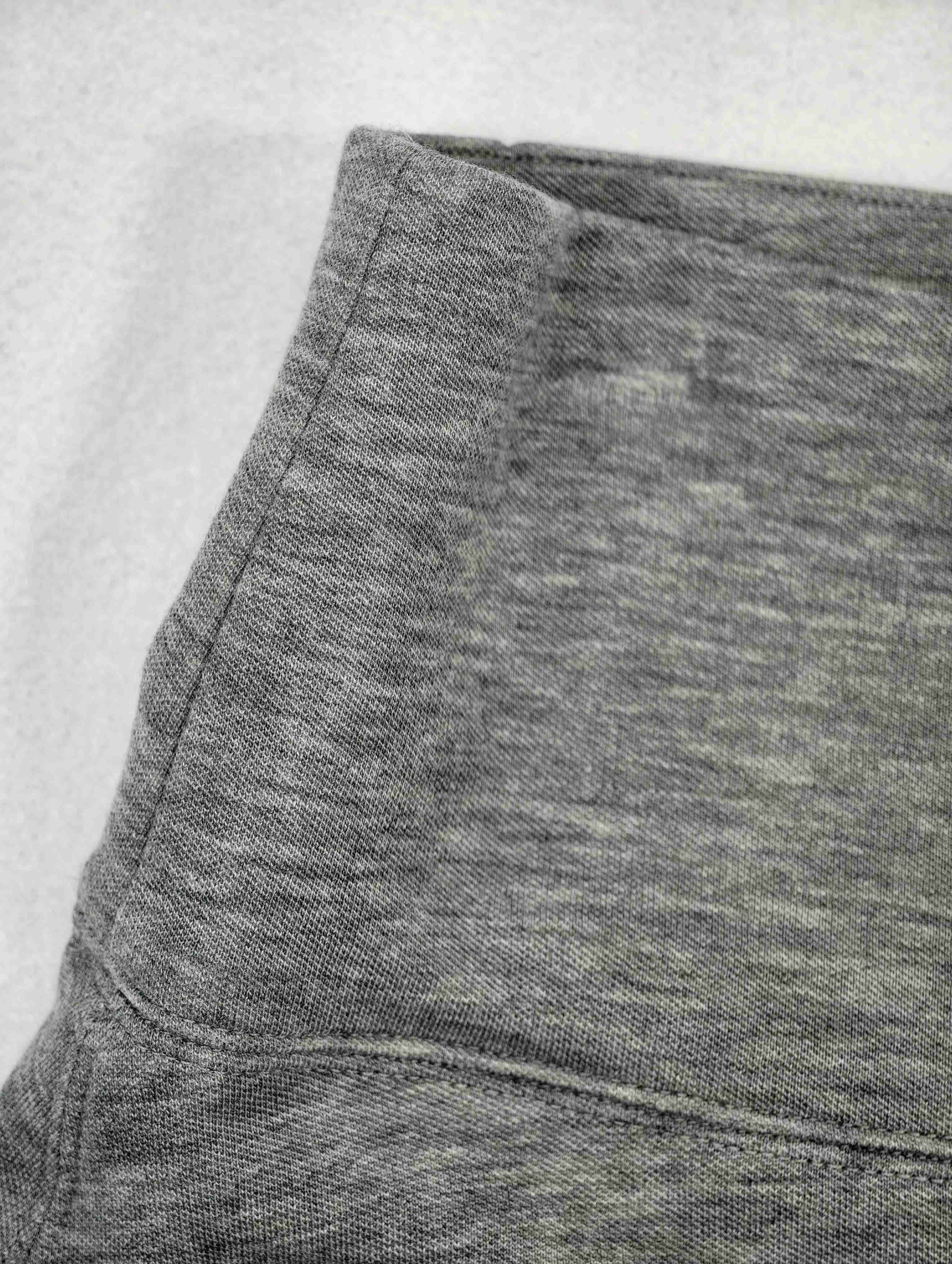 Wide waistband and curved panel seam construction detail