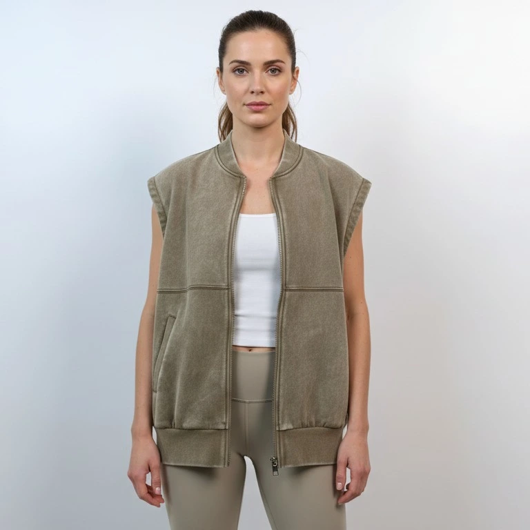 Model wearing washed olive sleeveless cotton utility vest