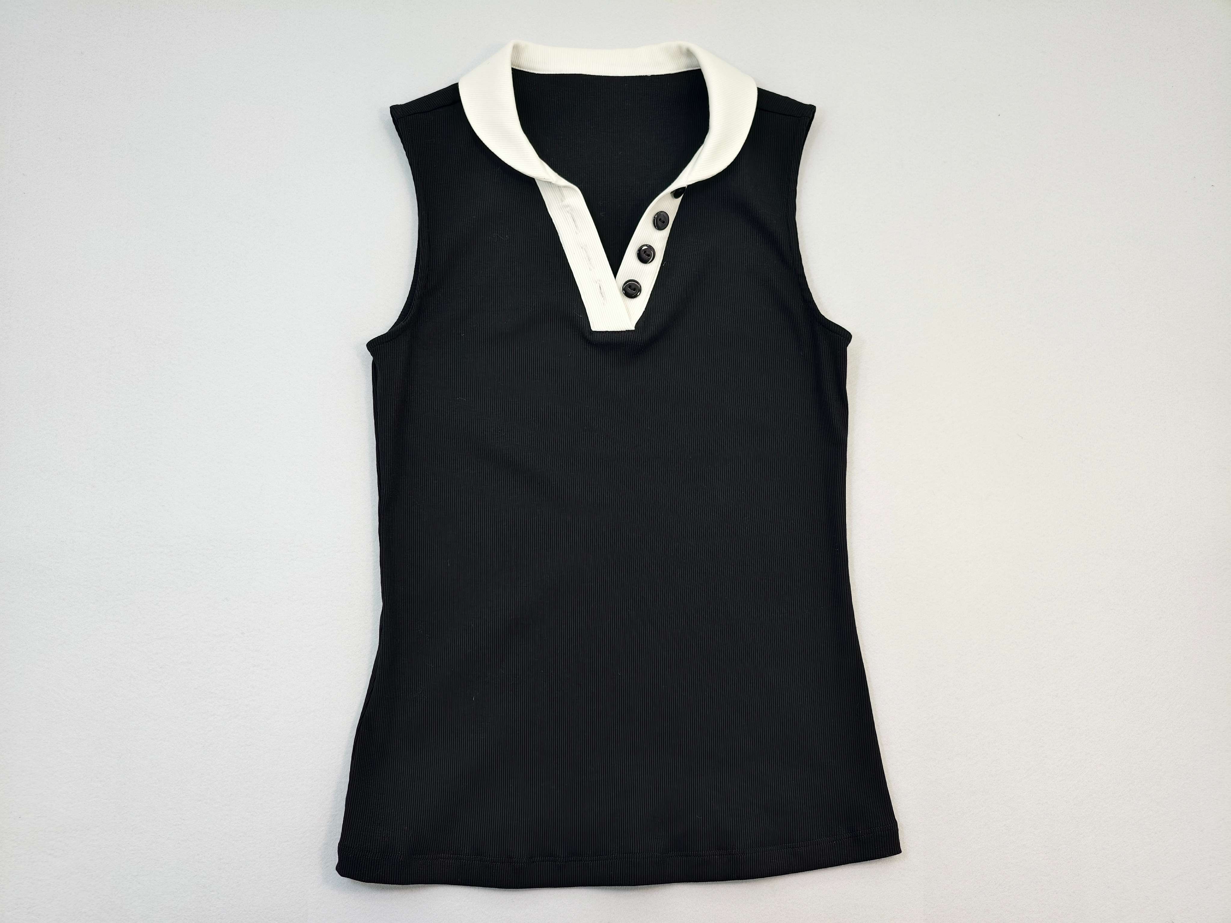 Black sleeveless polo top with white contrast collar