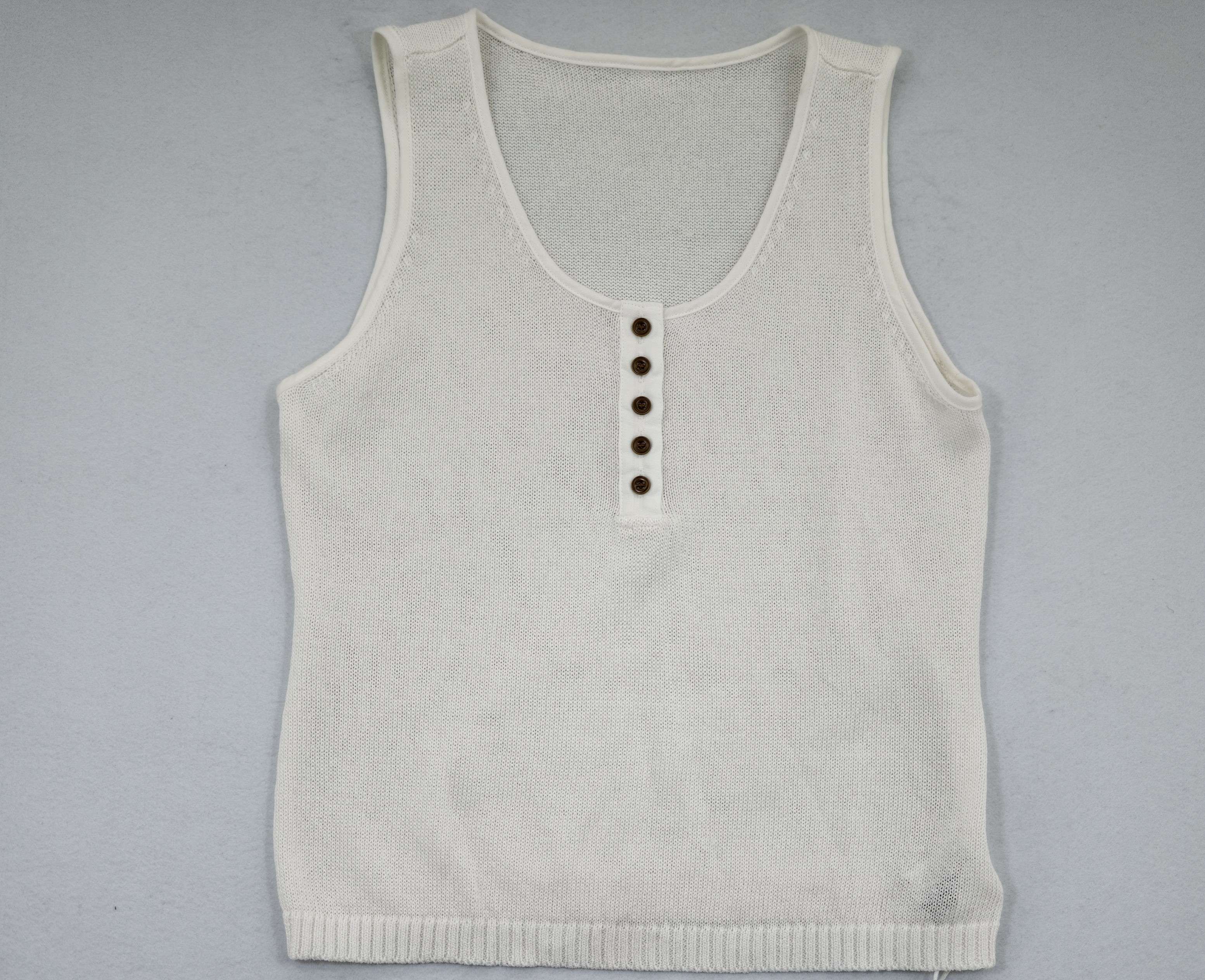 Women’s button-front sleeveless knit tank developed for OEM apparel programs