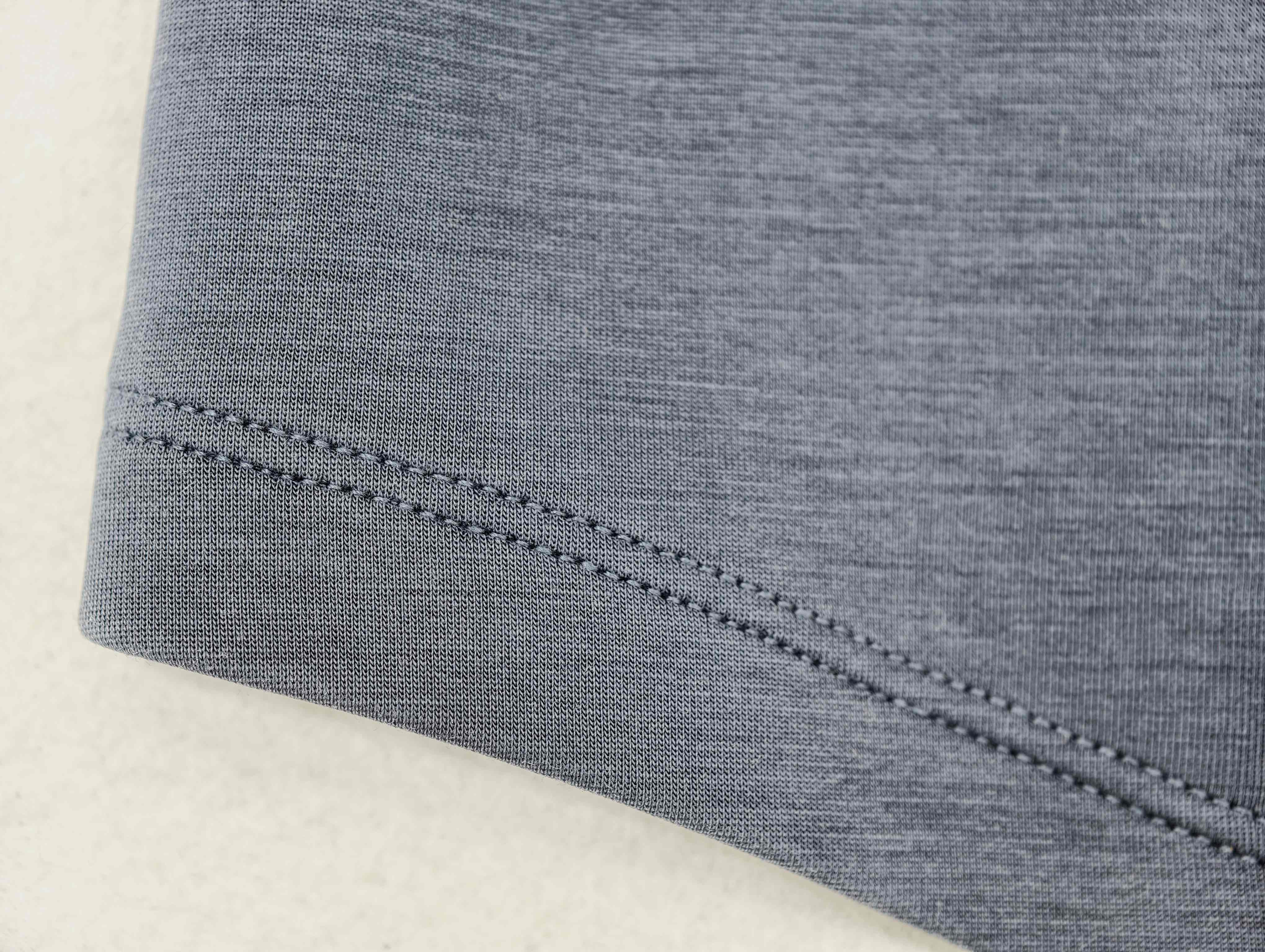 Smooth stretch jersey with reinforced curved hem stitching