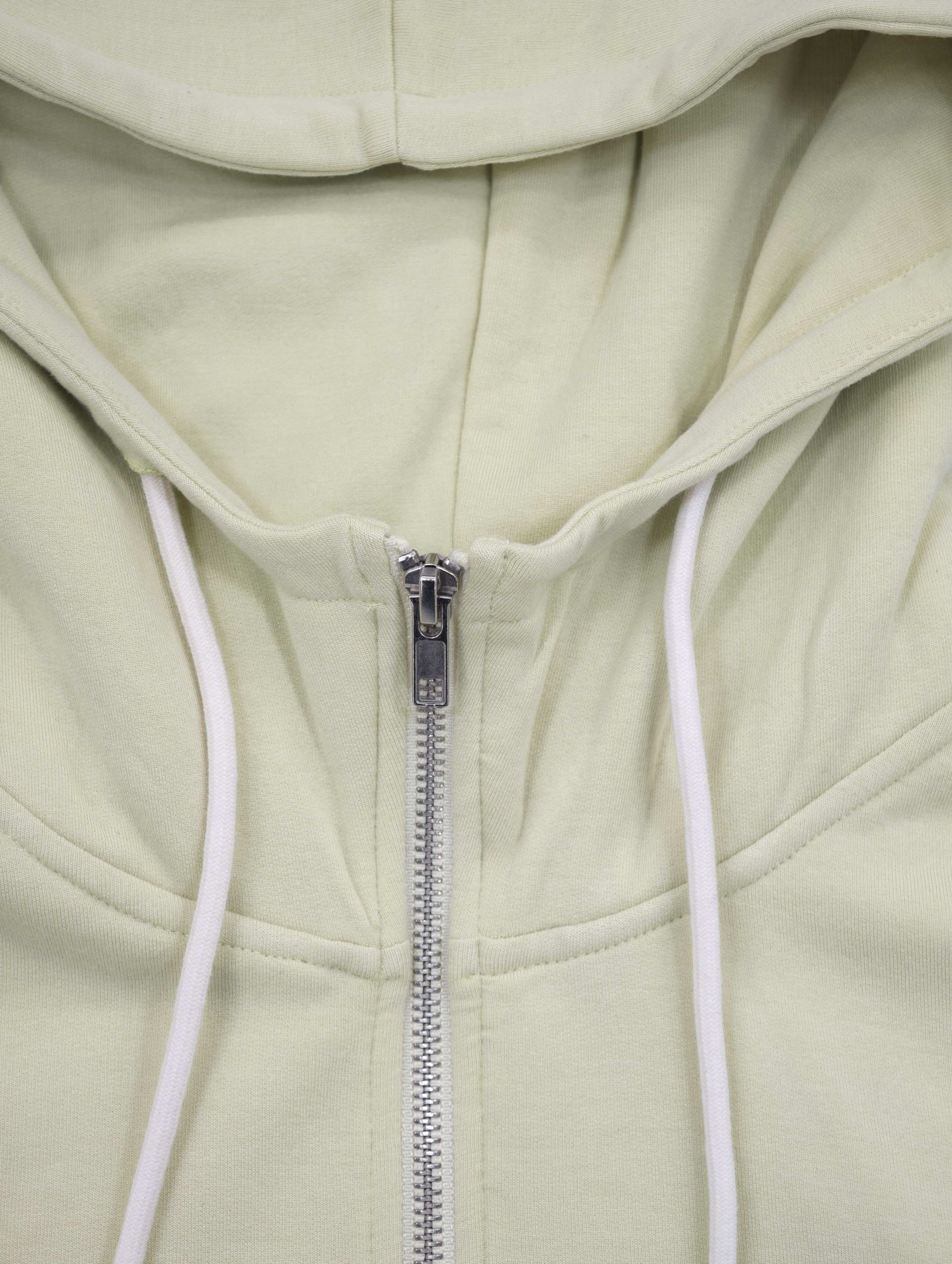 Drawcord hood and metal zipper construction detail