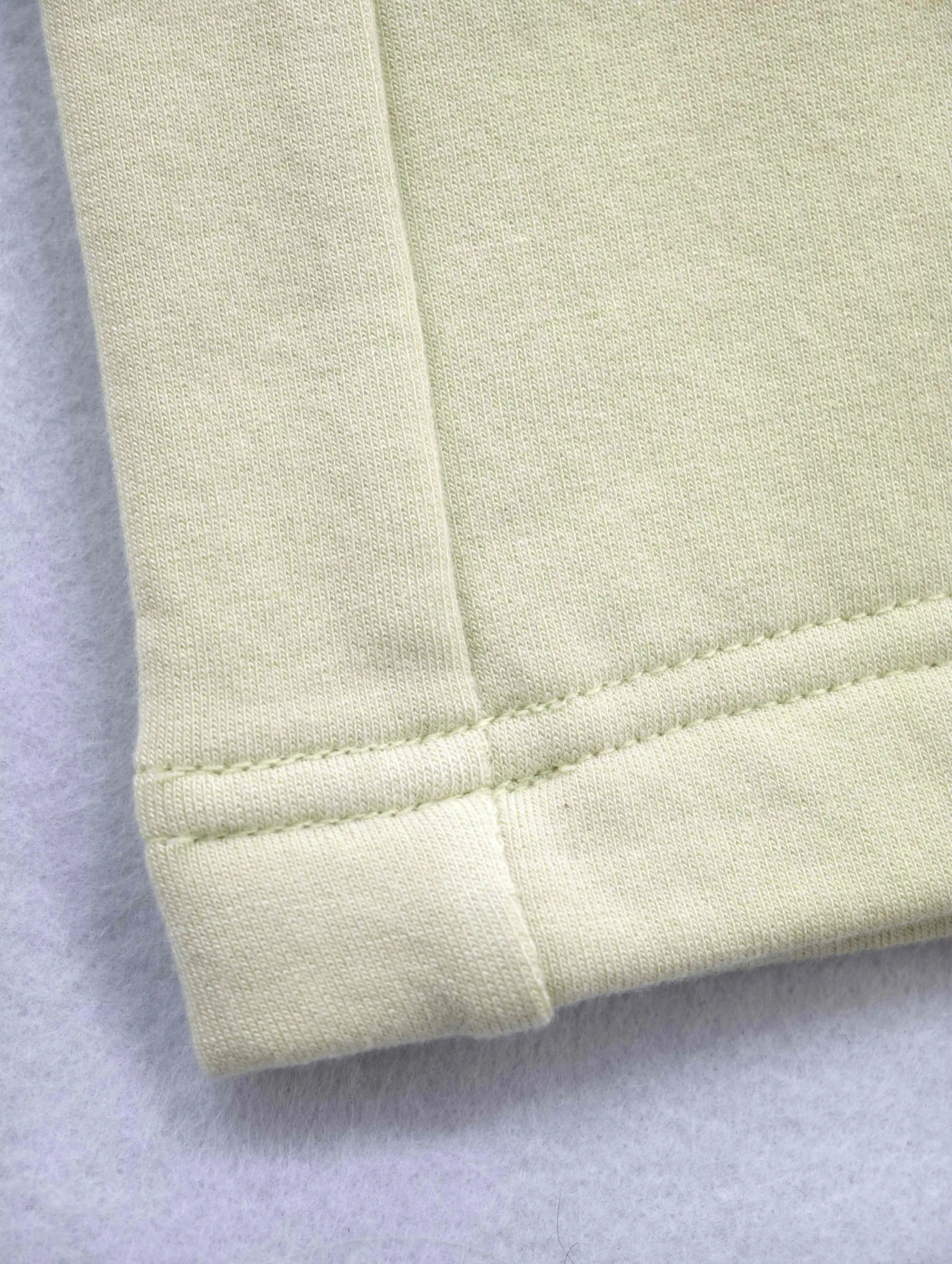Wide-leg trouser hem with clean topstitching detail