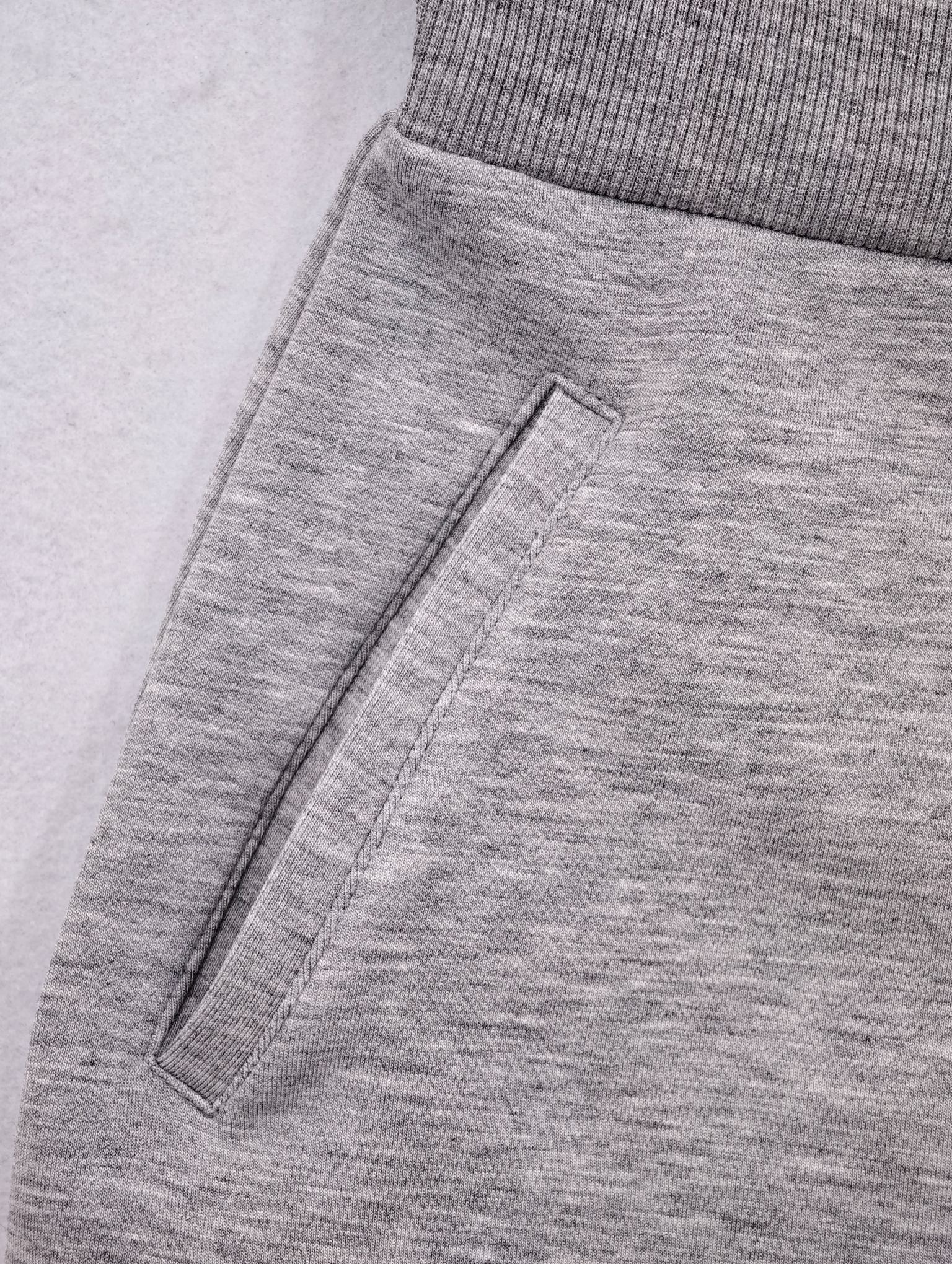 Side pocket and ribbed waist panel construction