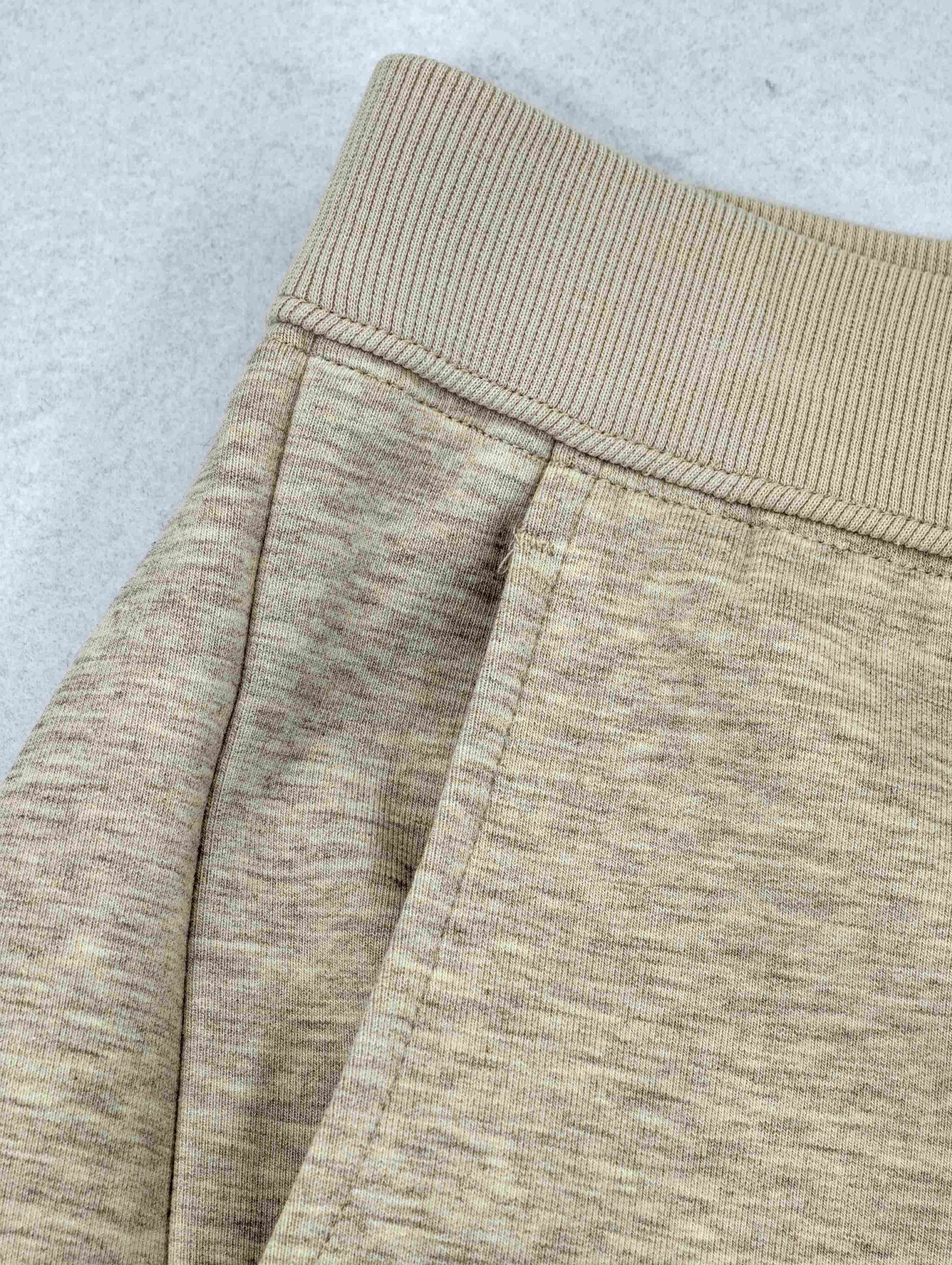 Wide rib waistband and side pocket construction detail