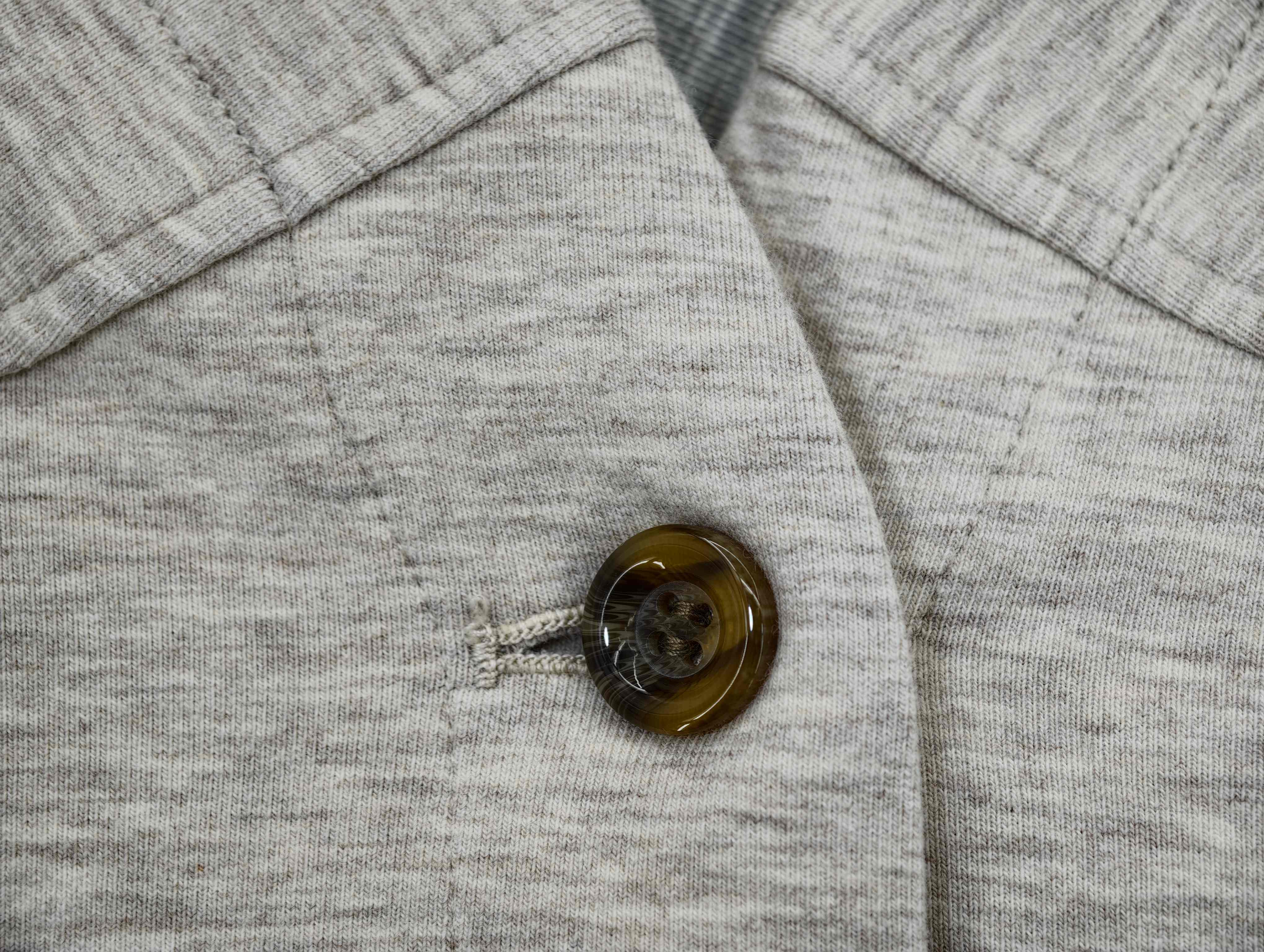 Three-button placket with reinforced buttonhole stitching