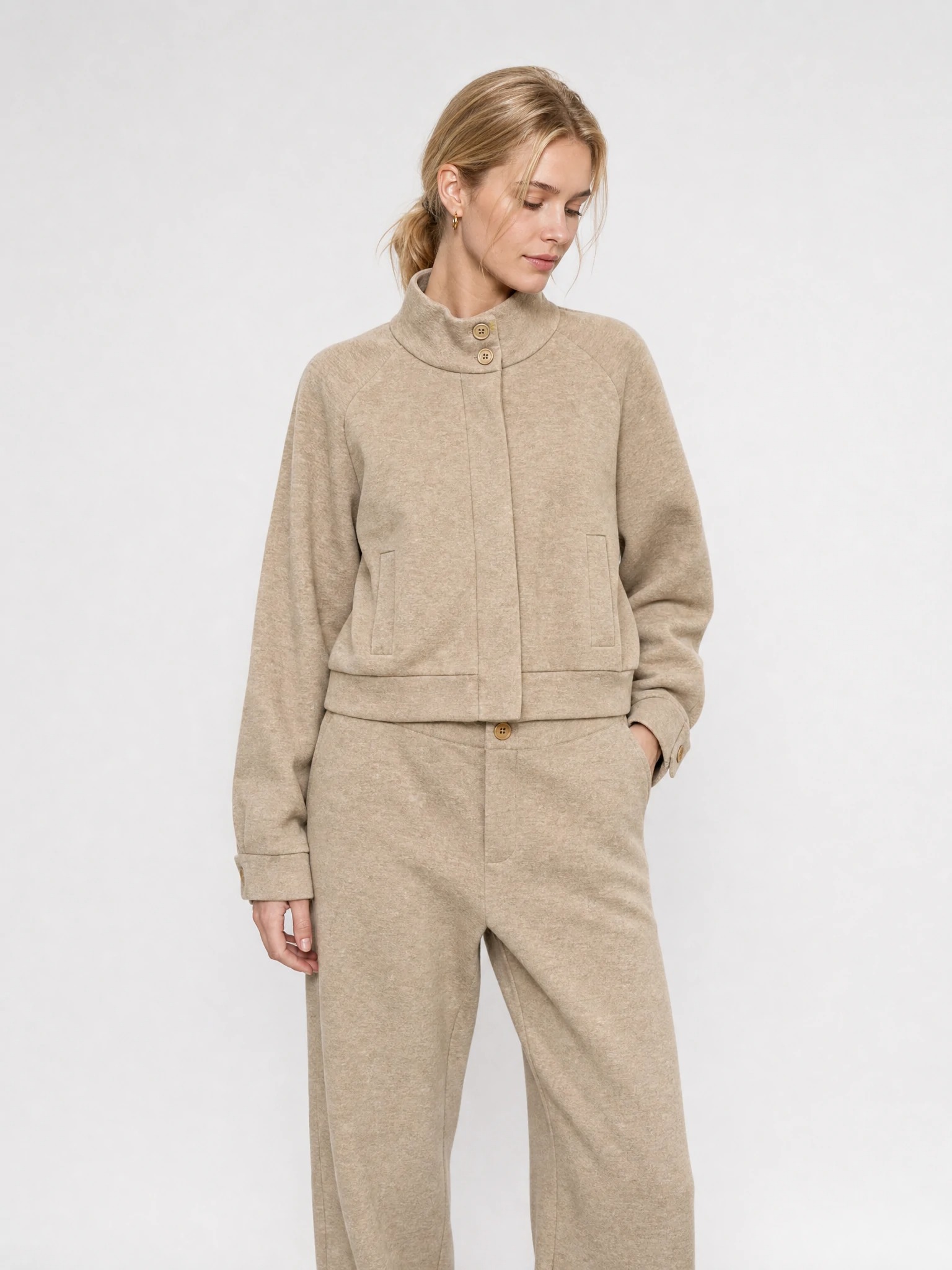 Women wearing oatmeal high-collar raglan jacket matching set
