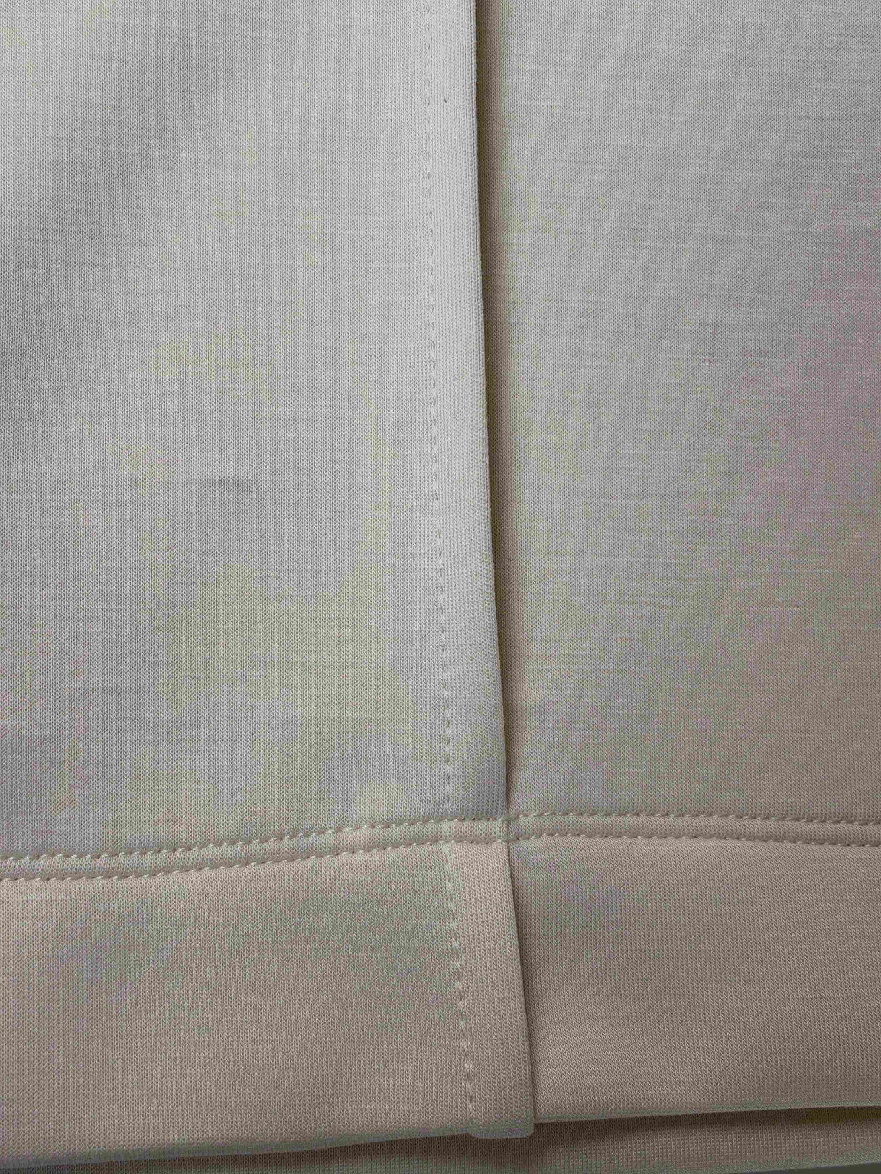 Stretch knit texture and stitched pintuck close-up