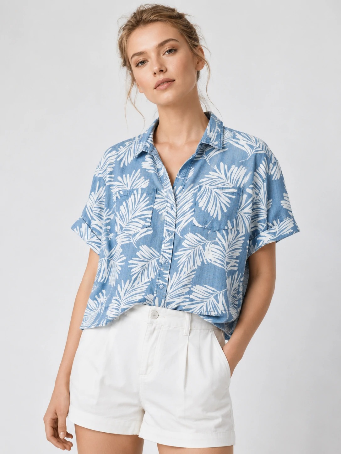 Model wearing blue botanical-print Tencel short-sleeve shirt