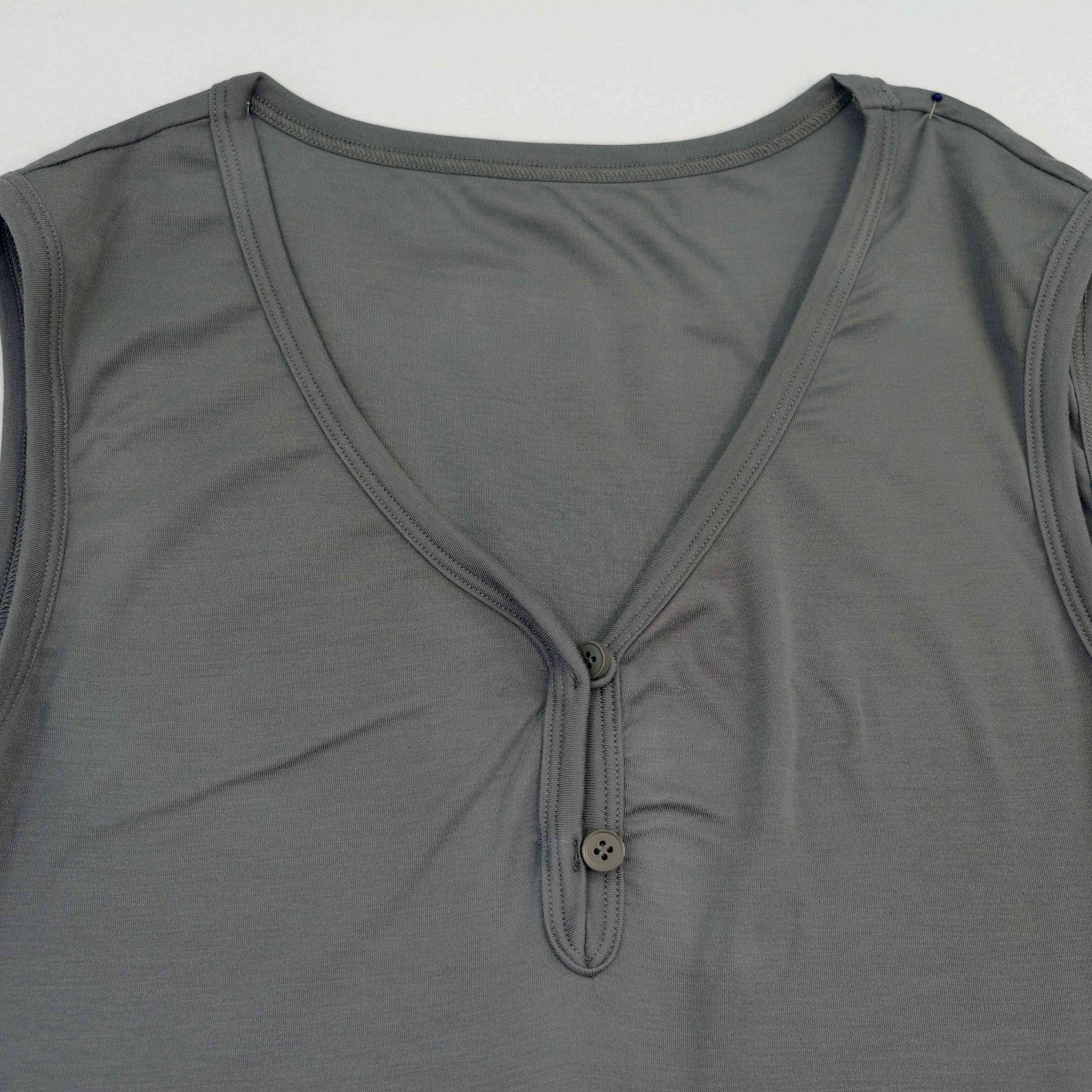 V-neck Henley opening with button detail