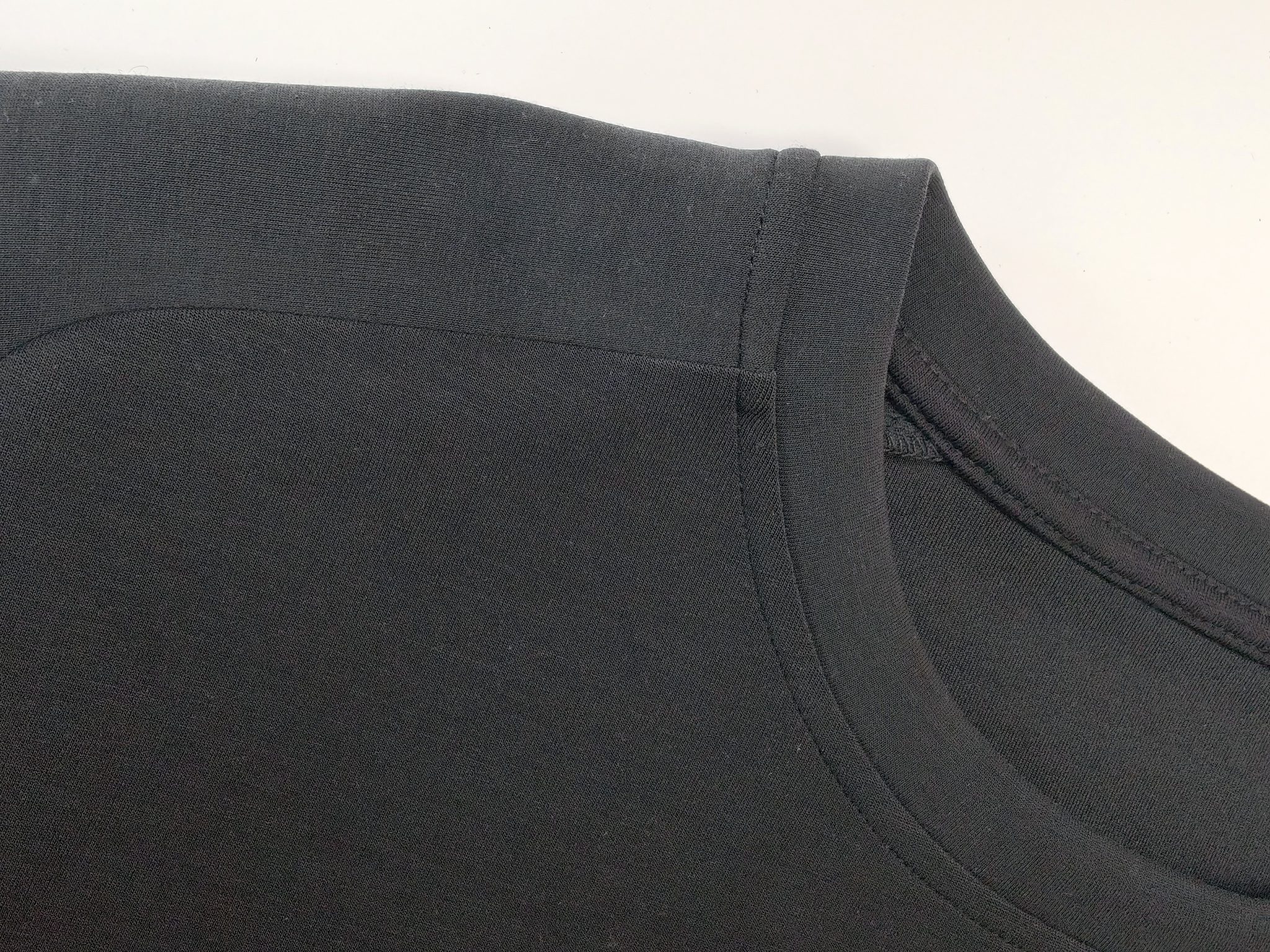 Sand-washed scuba texture and reinforced seam close-up