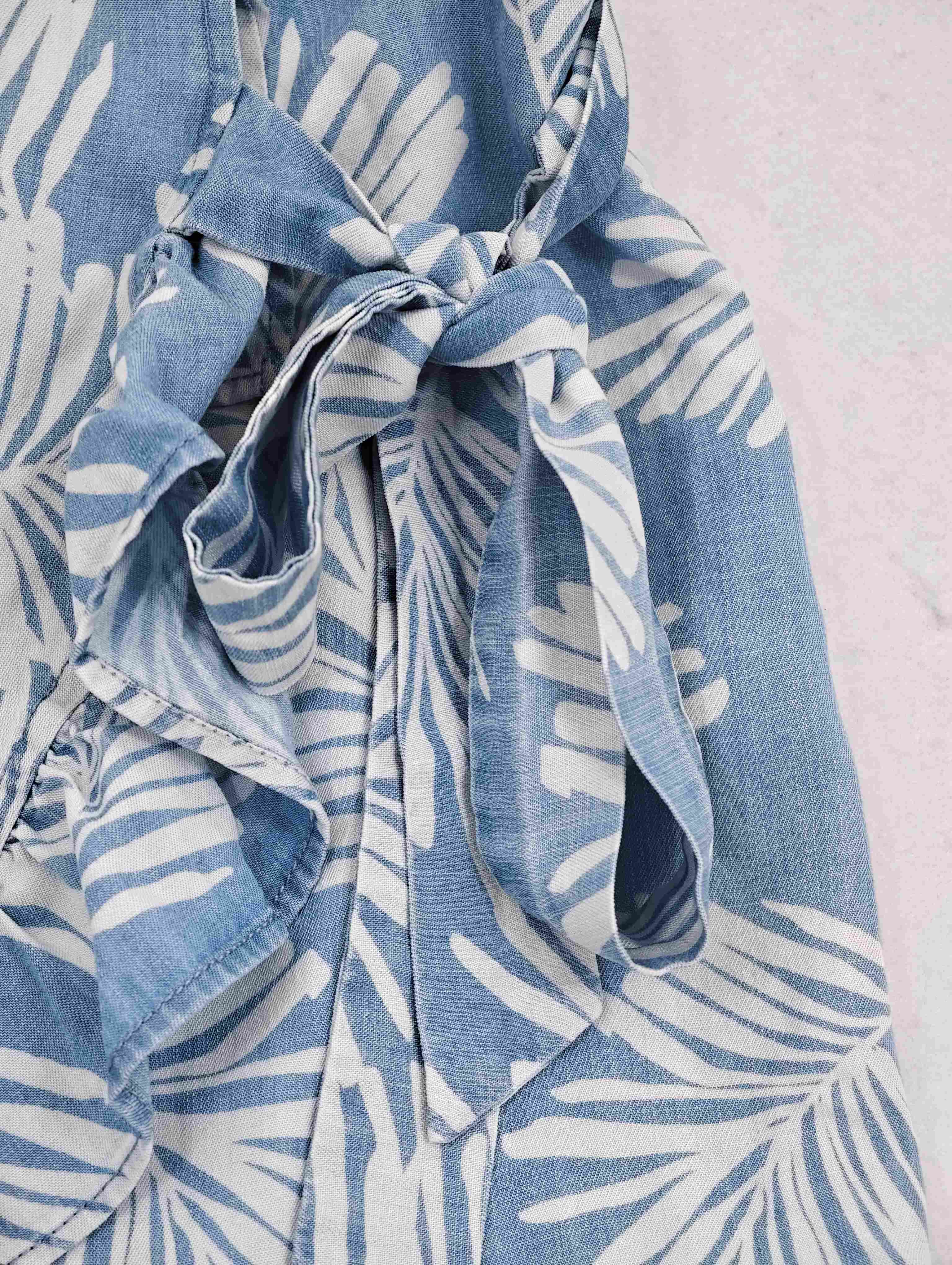 Adjustable side tie and gathered waist construction detail