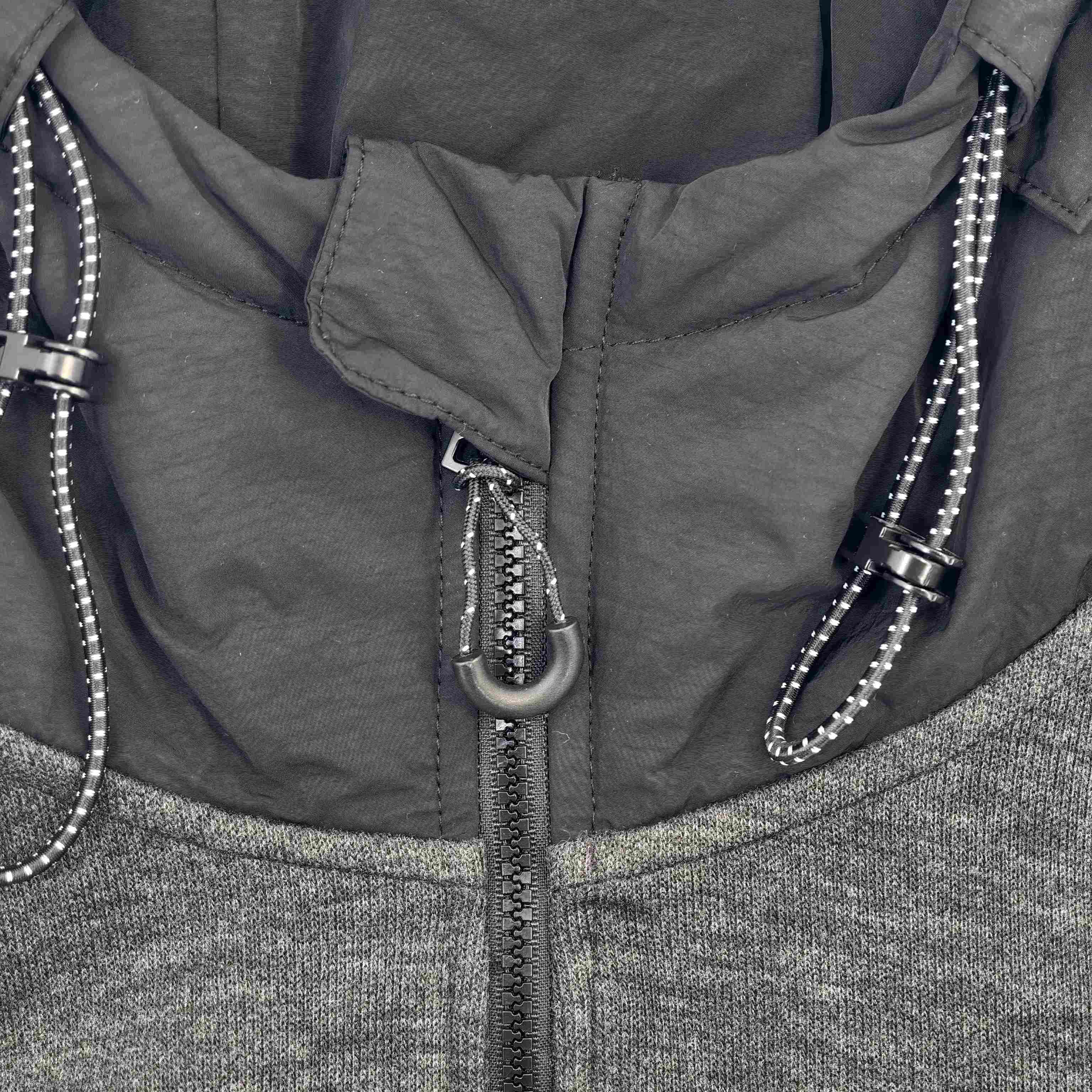 Half-zip neckline and adjustable hood detail close-up
