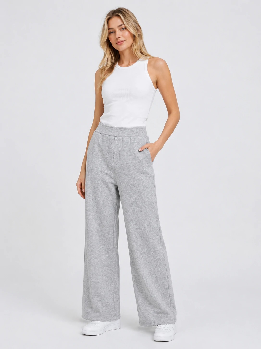 Model wearing heather grey high-waisted wide-leg pants