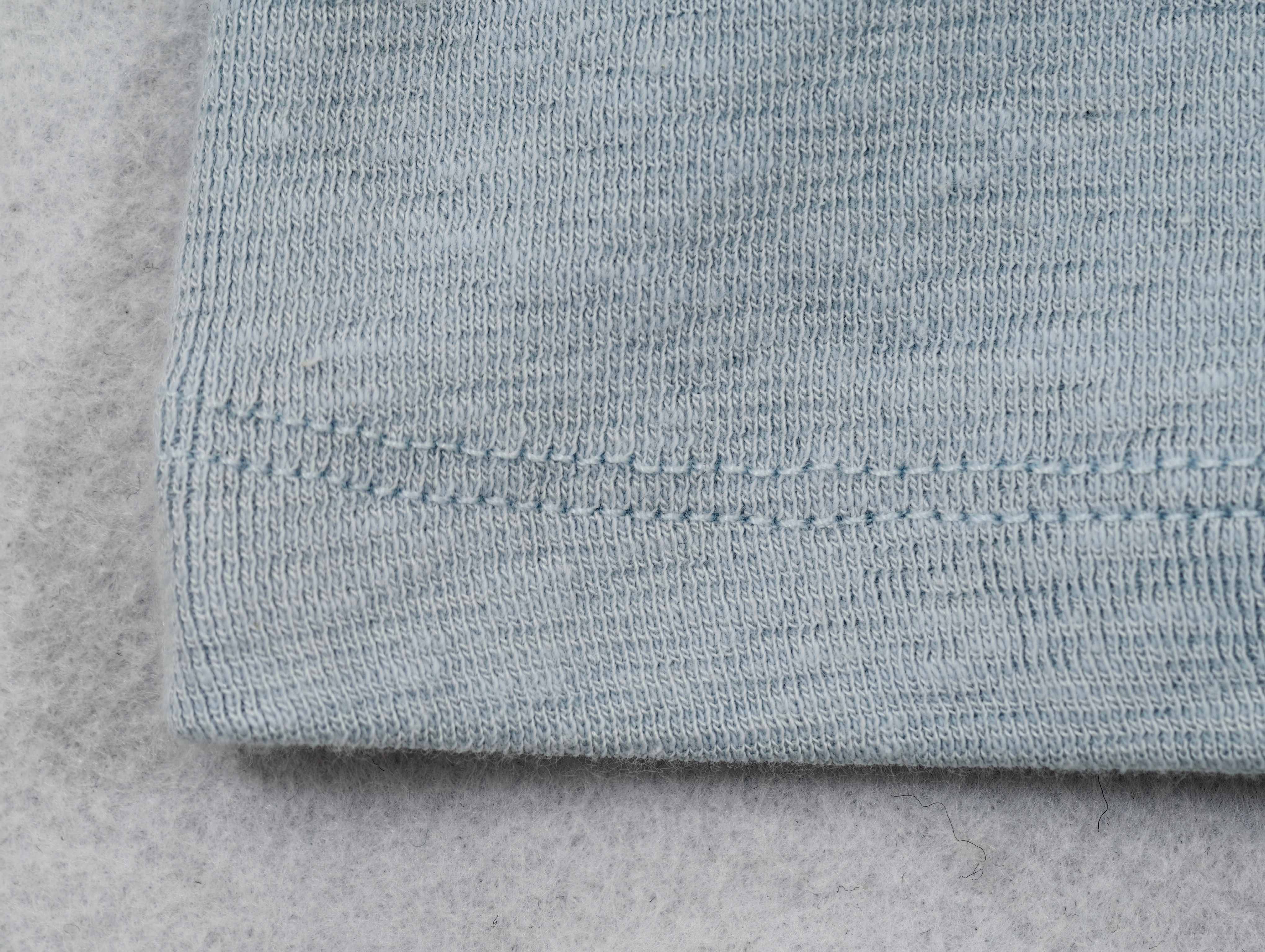 Soft stretch jersey texture with clean twin-needle hem