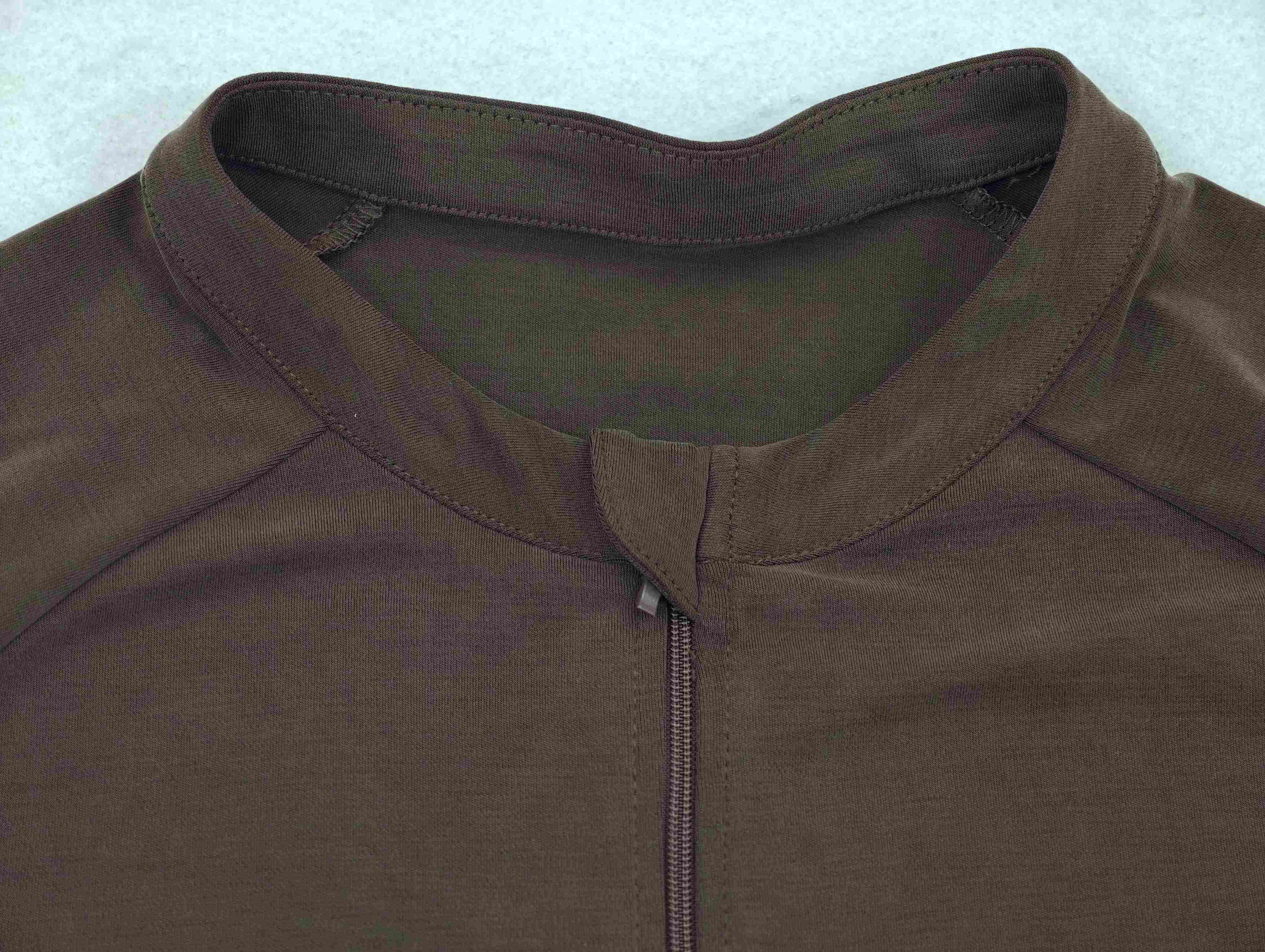 Stand collar and zipper construction by an activewear manufacturer