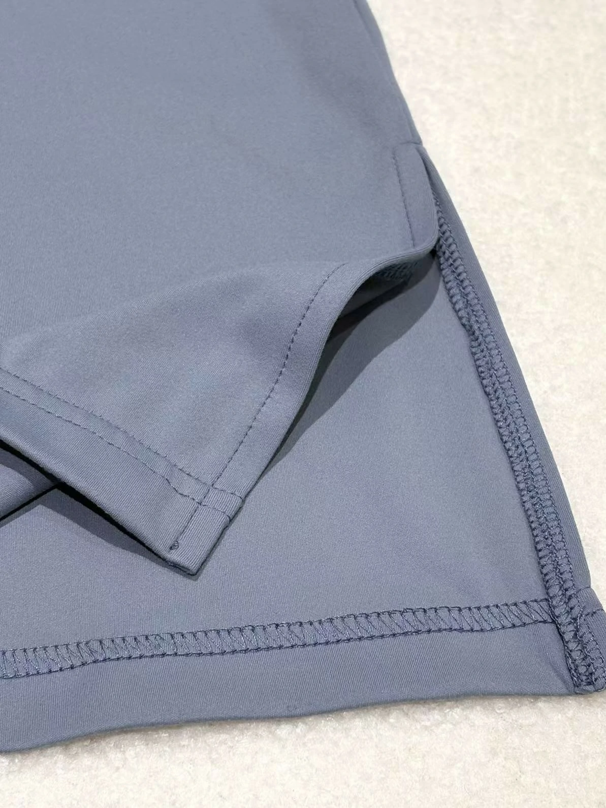 Side slit hem and stretch stitching detail on flared pants