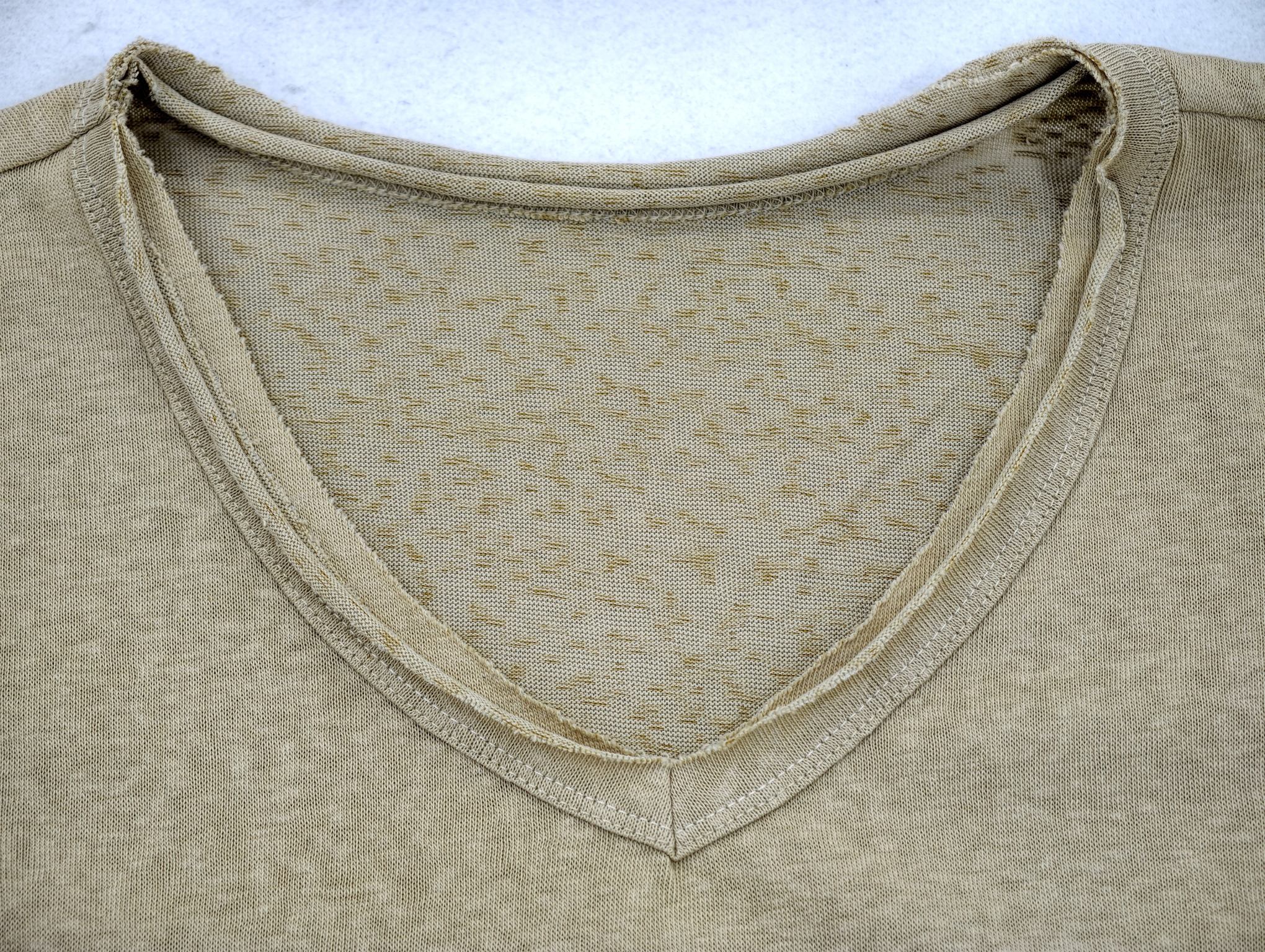 Layered V-neck binding with softly distressed outer edge