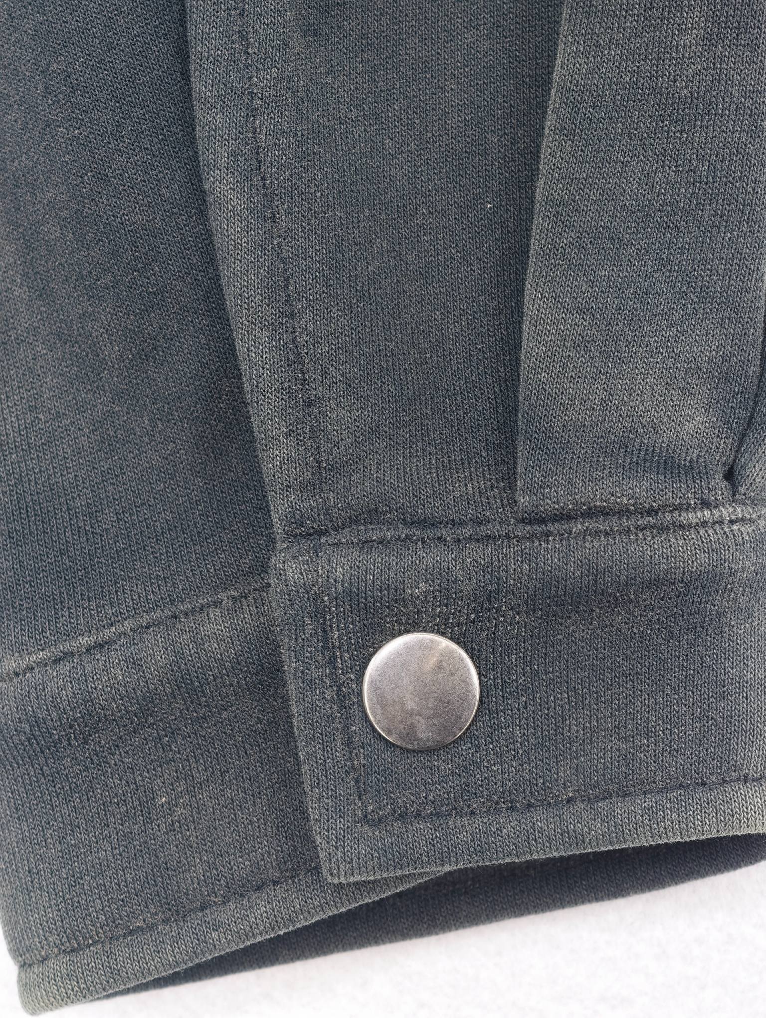 Cuff snap button and fabric texture detail