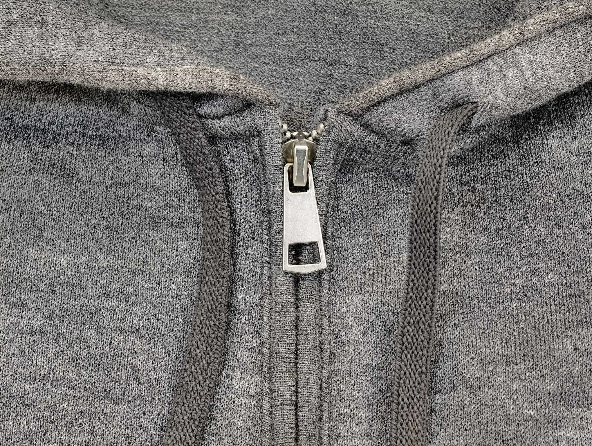 Custom metal zipper and hood opening detail