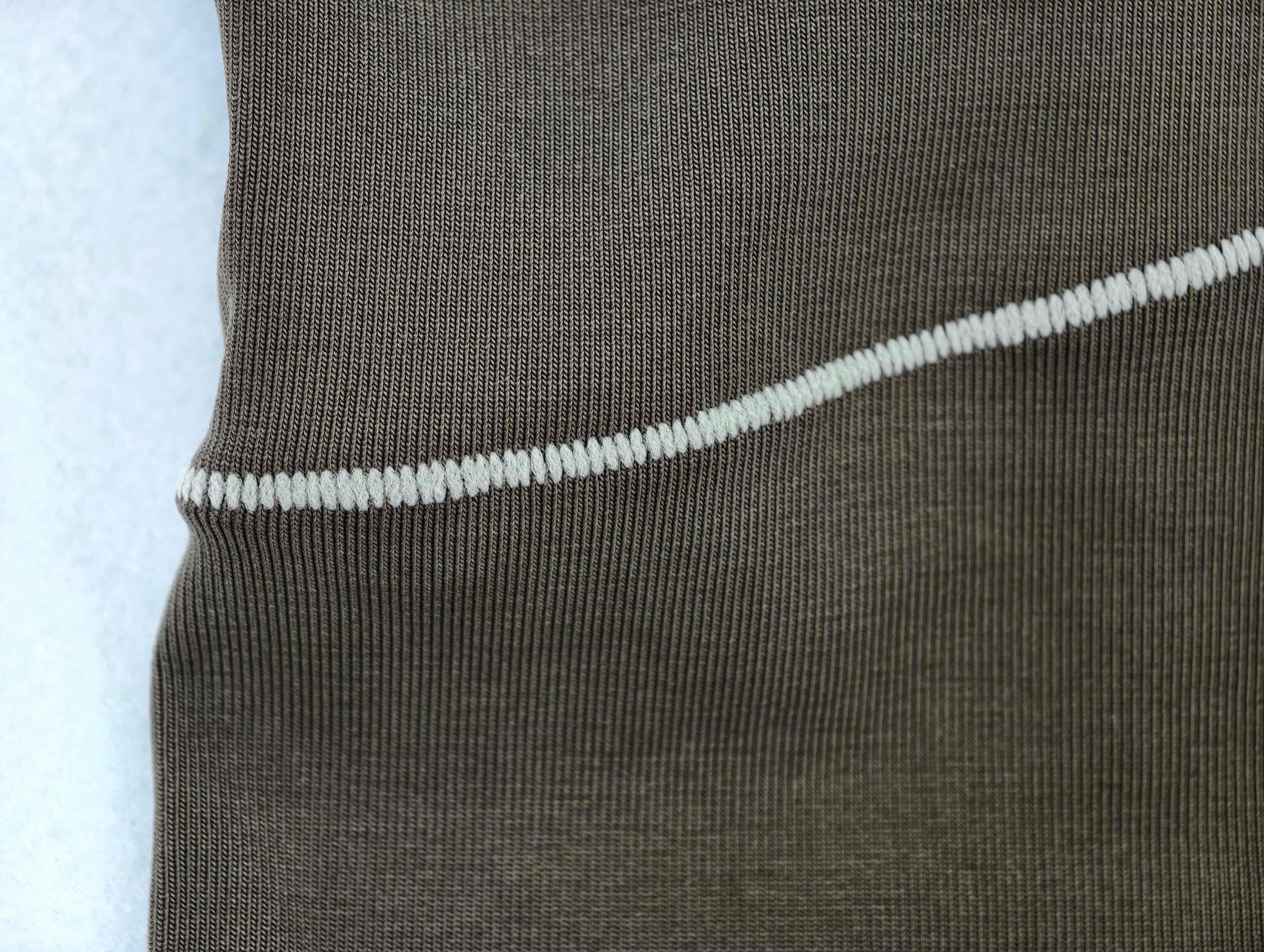Contrast curved seam detail on dark Modal-blend jersey