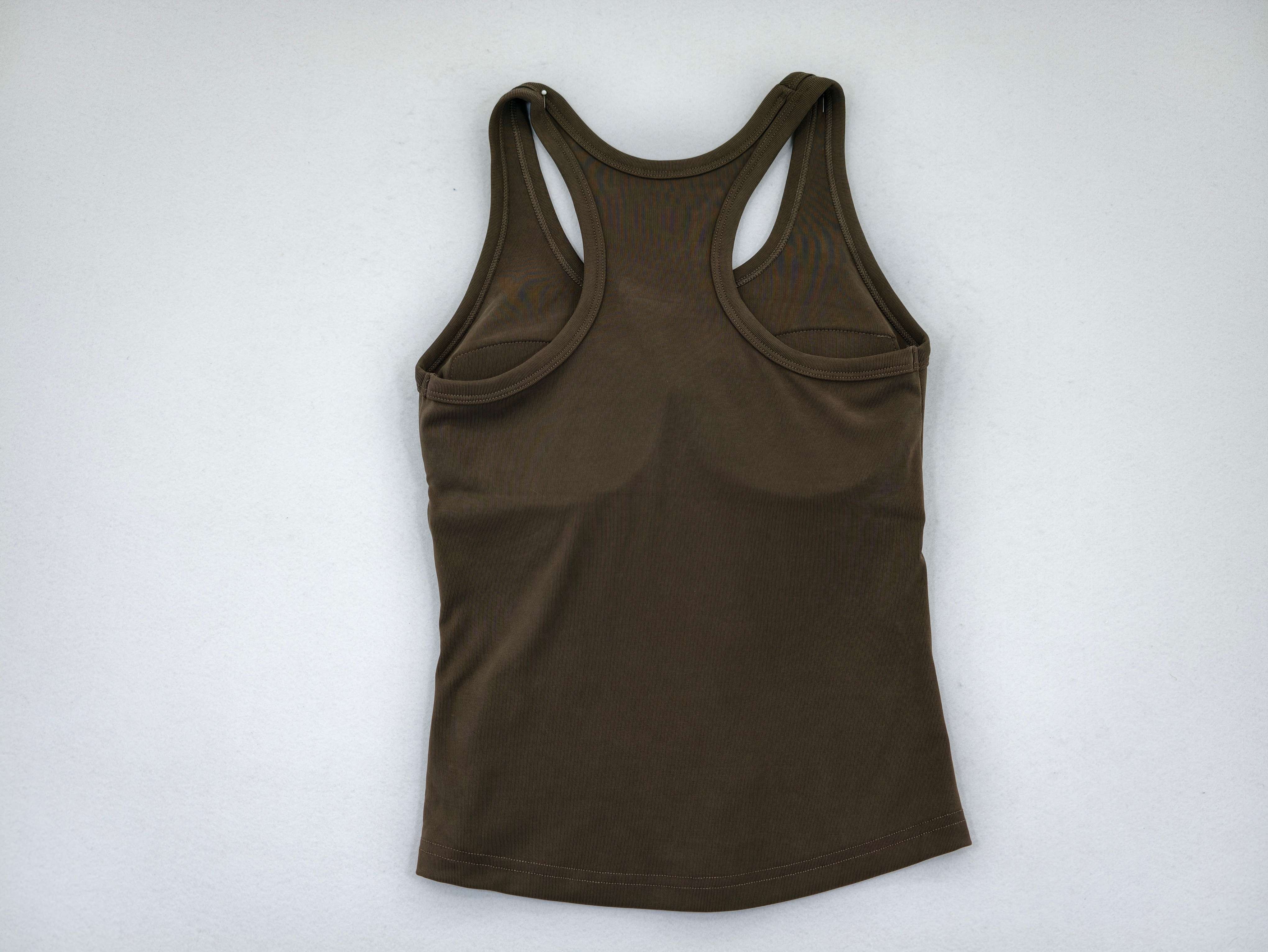 Fitted racerback tank showing clean back and curved hem