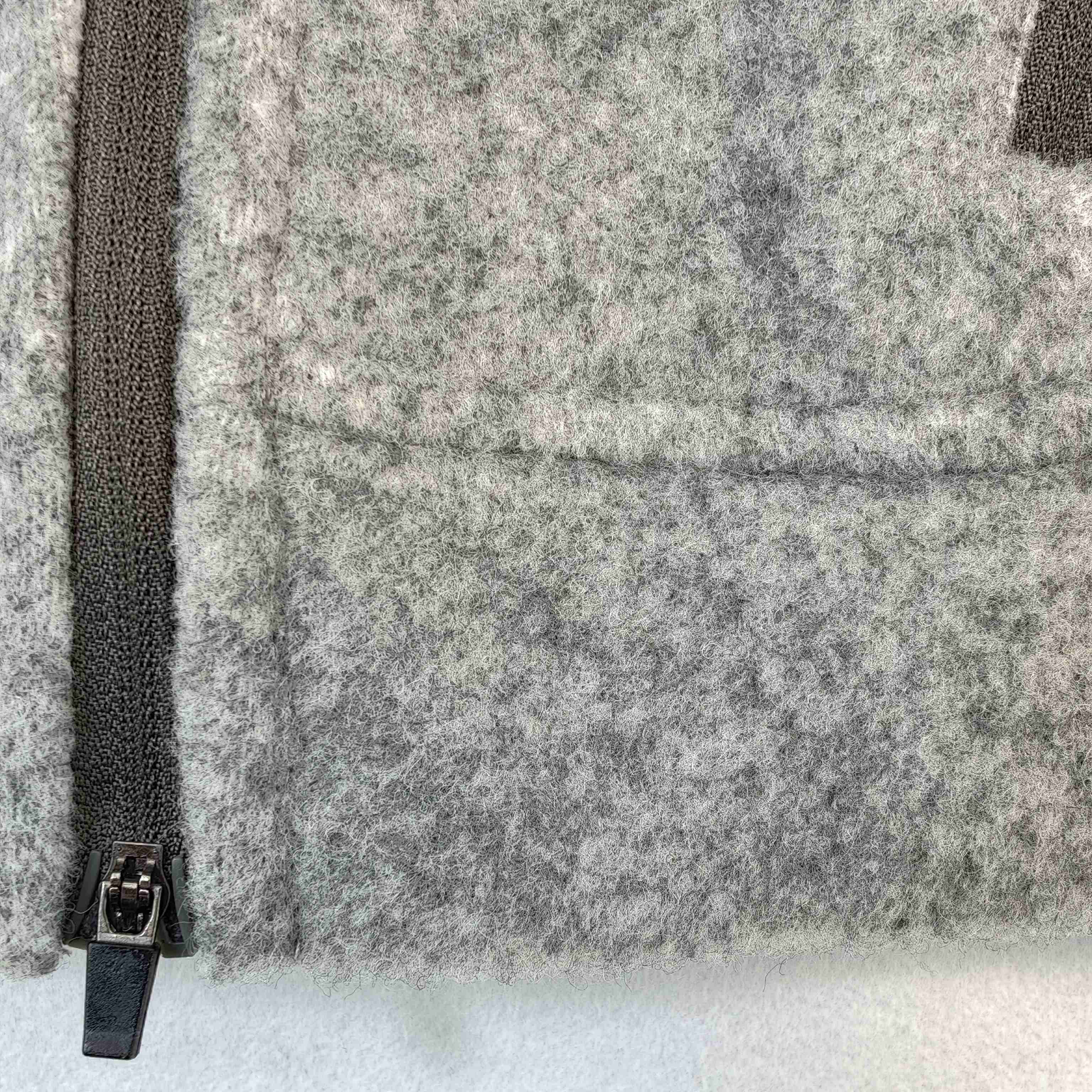 Brushed bonded fleece texture with zip pocket construction