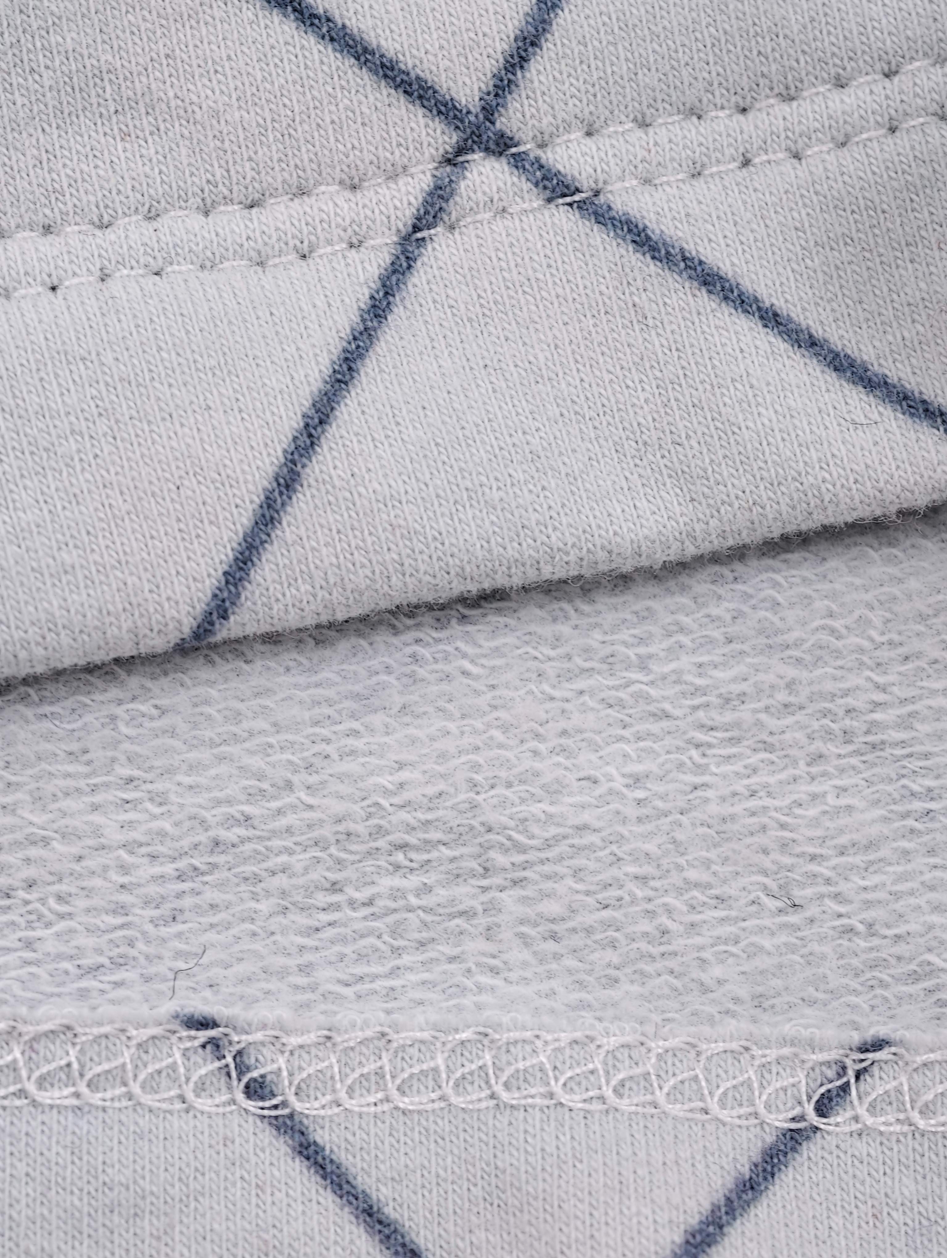 Printed knit hem with visible looped interior texture