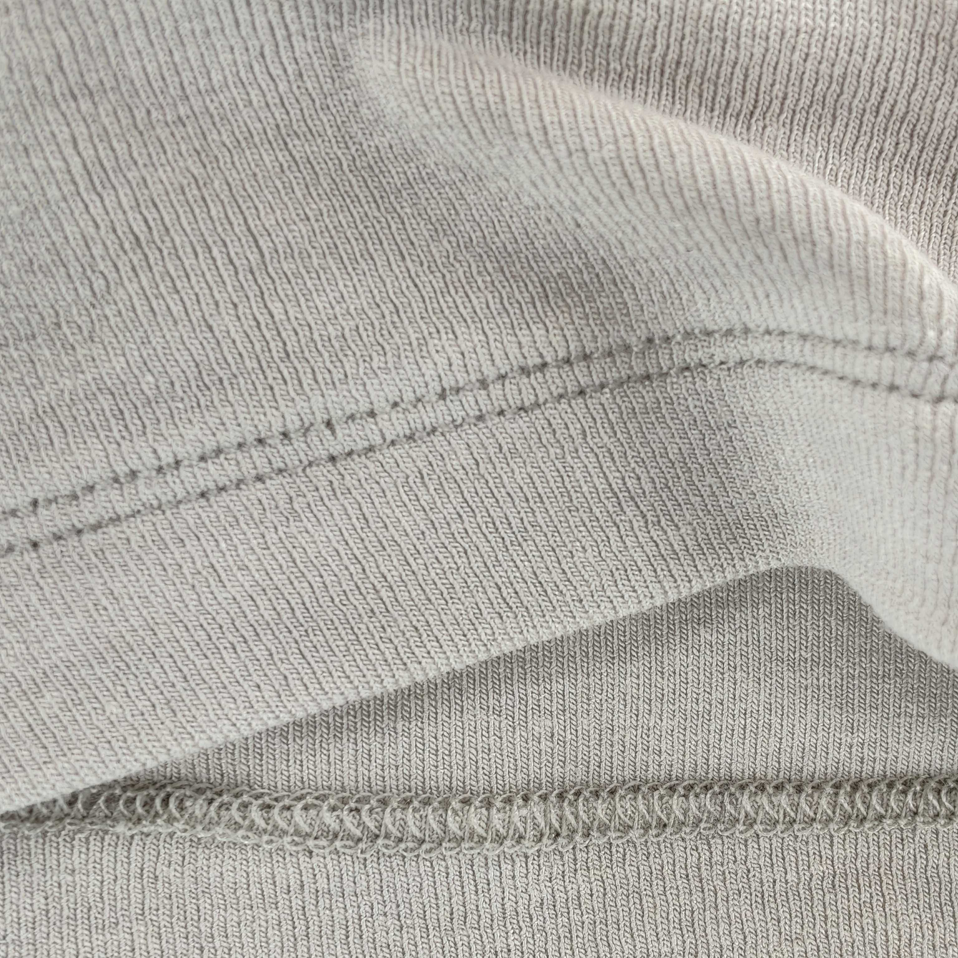 Fine stretch rib texture with clean coverstitch seam