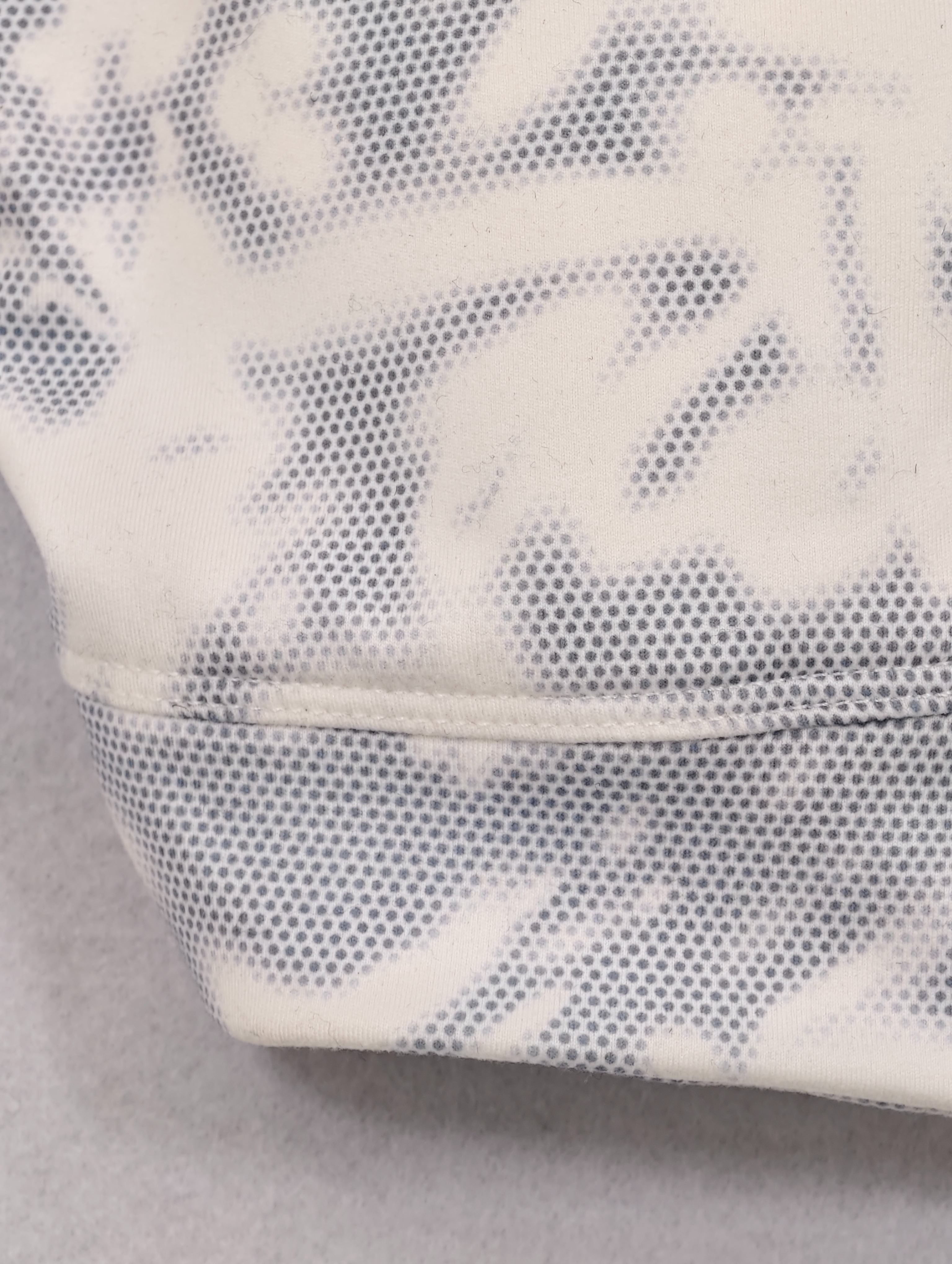 Wide underbust band and curved seam construction detail