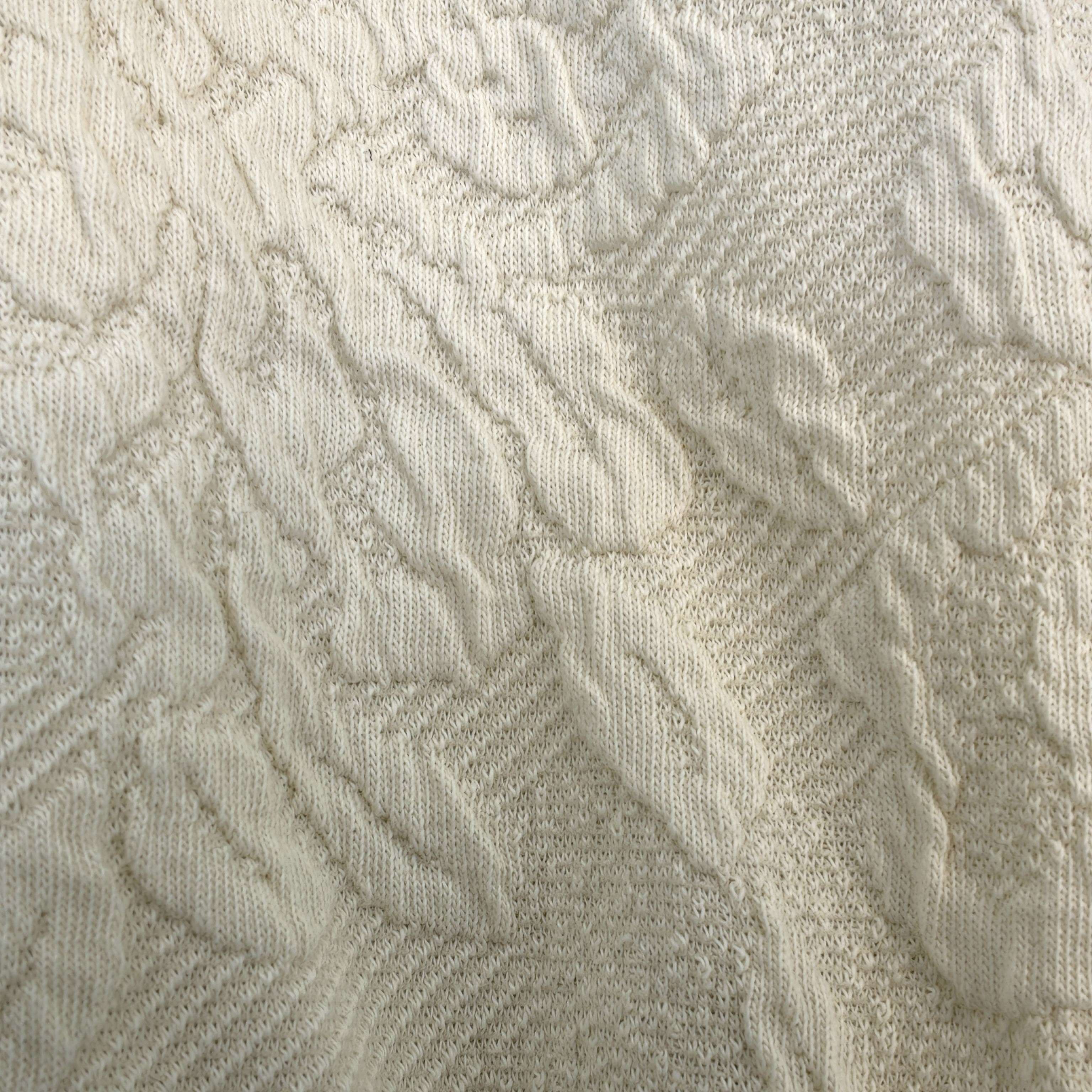 Close-up of raised floral geometric jacquard fabric texture