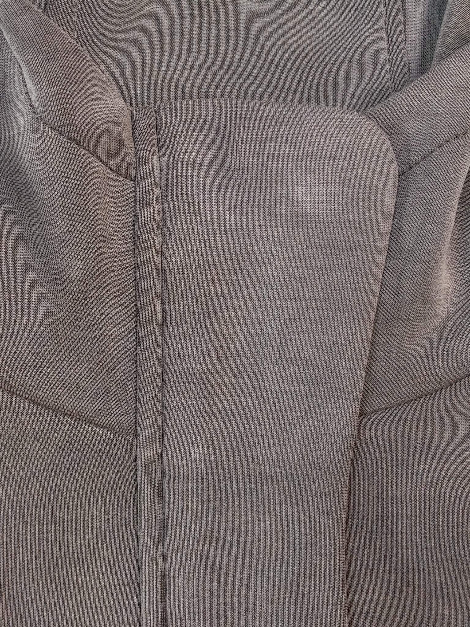 Covered zipper construction and stretch knit texture close-up