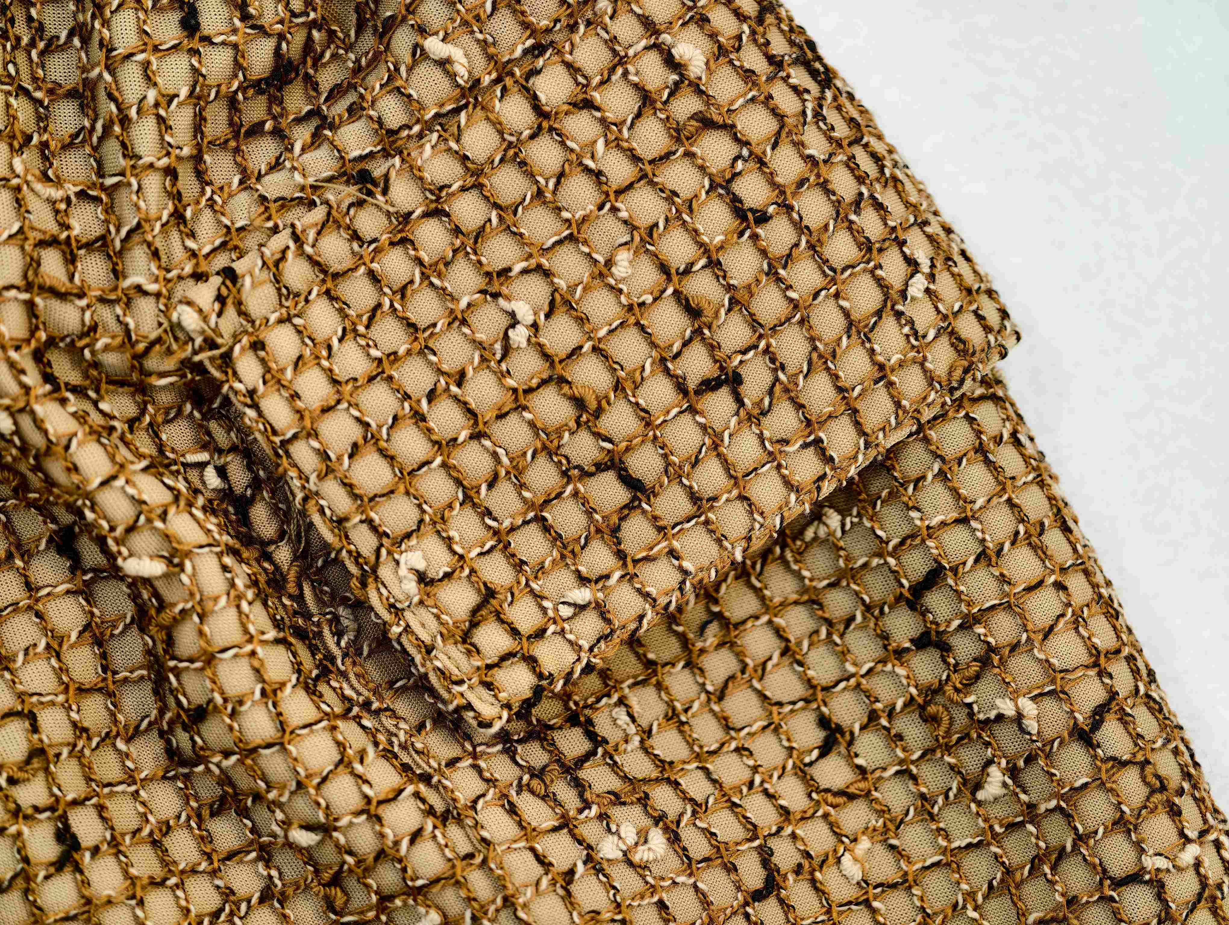 Bonded mesh pocket flap with visible layered construction
