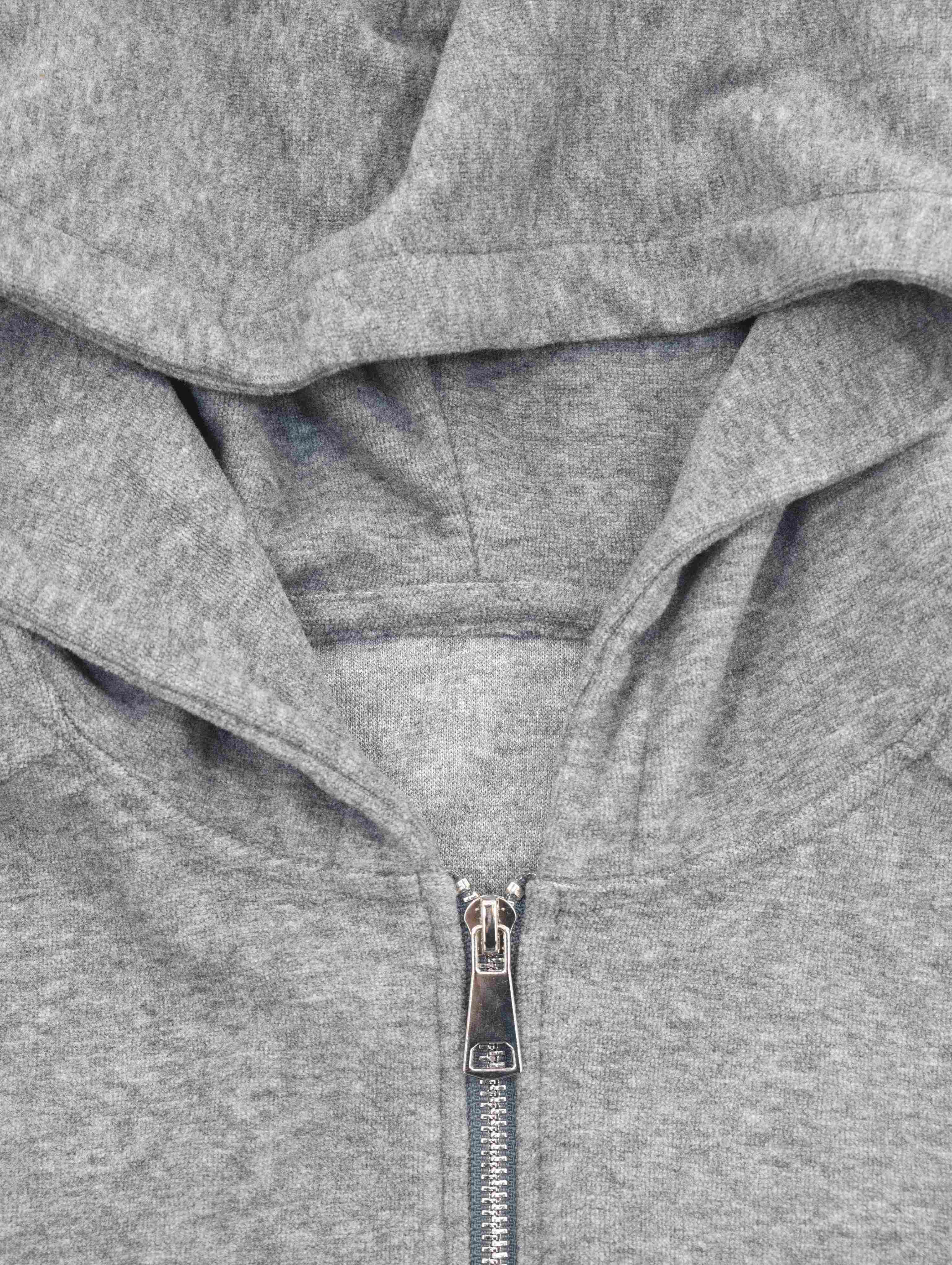 Double-layer hood and metal zipper construction close-up