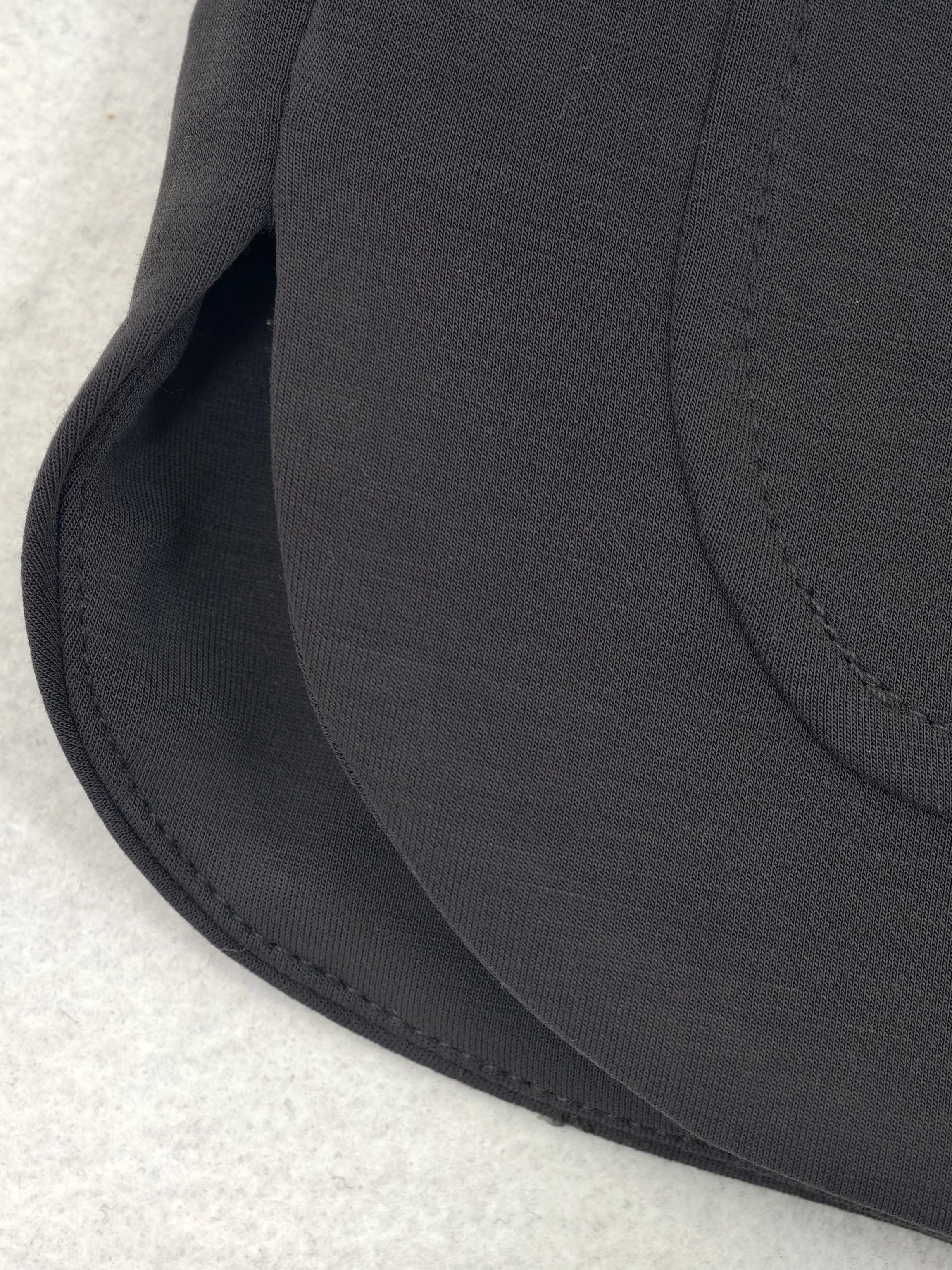 Curved side hem construction by an activewear manufacturer