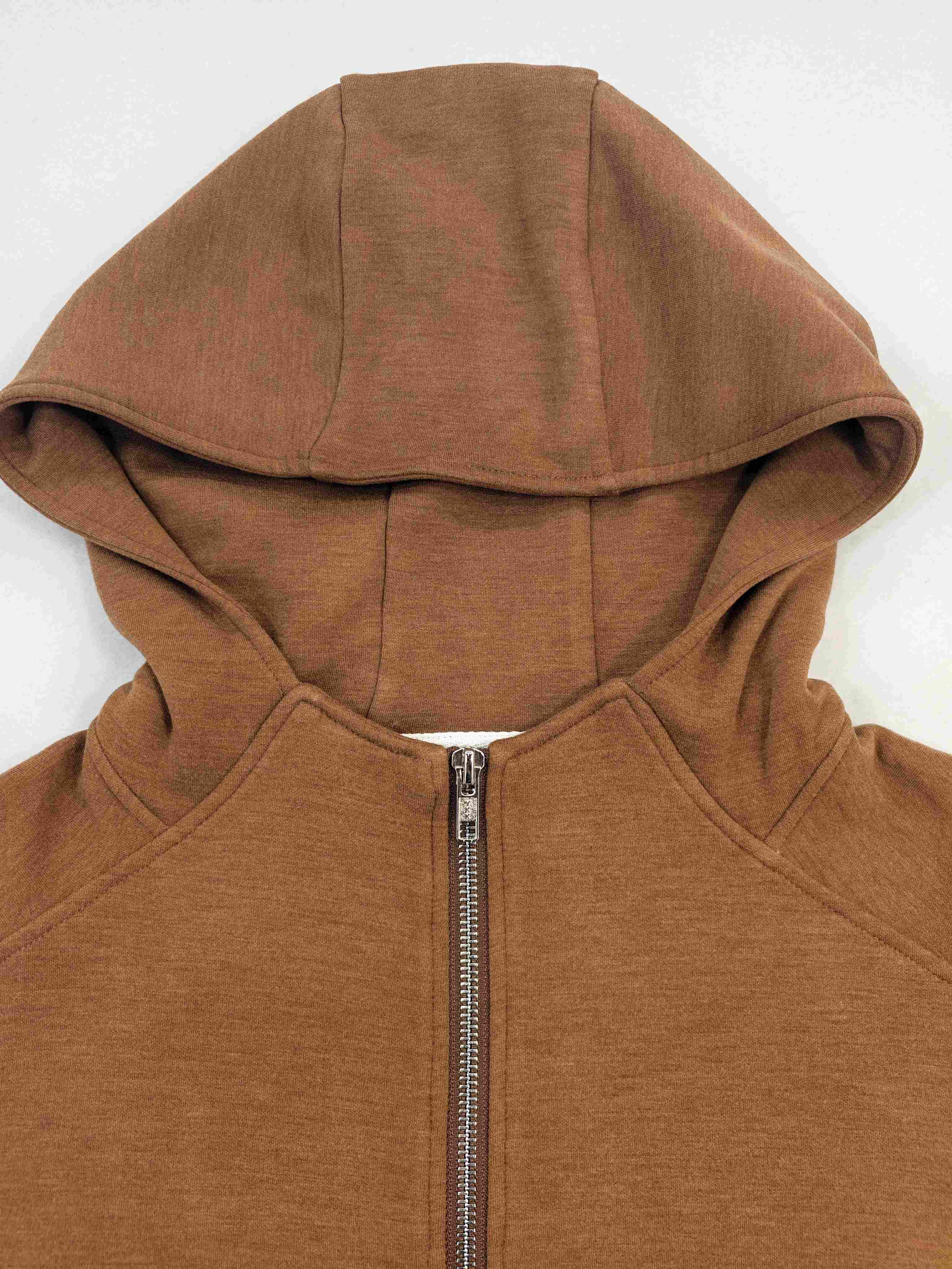 Hood neckline and full metal zipper detail close-up