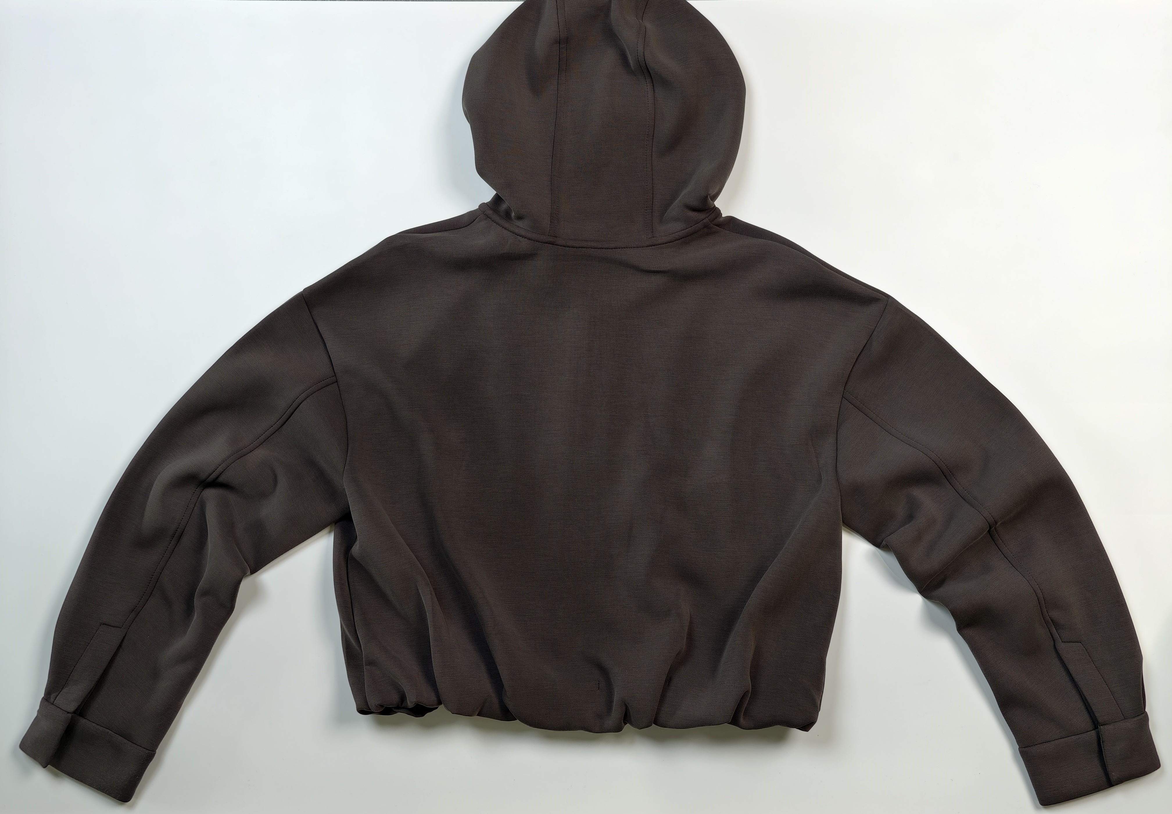 Back flat view showing hood and relaxed shoulder seams