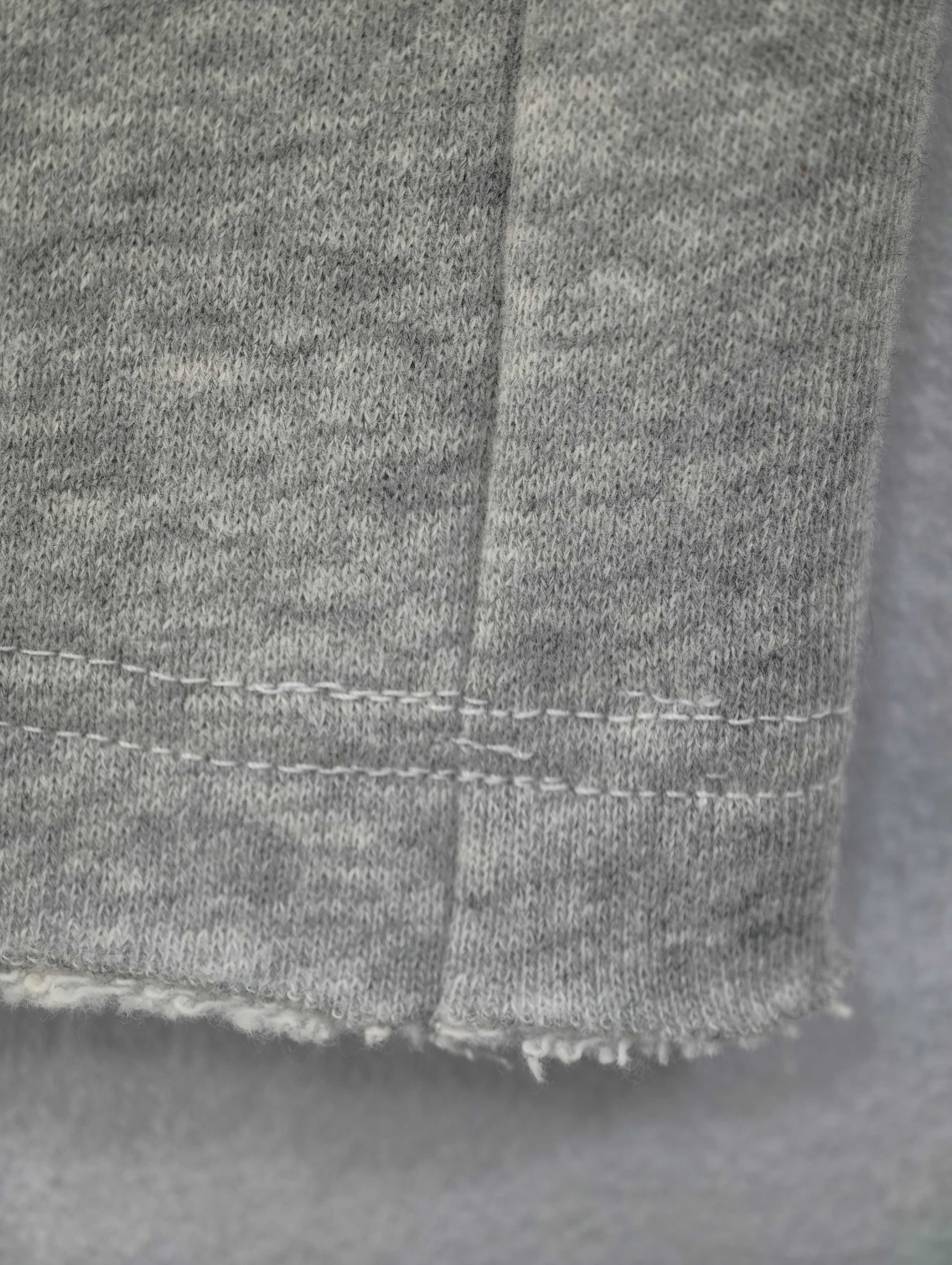 Cotton-blend fabric and raw hem seam close-up