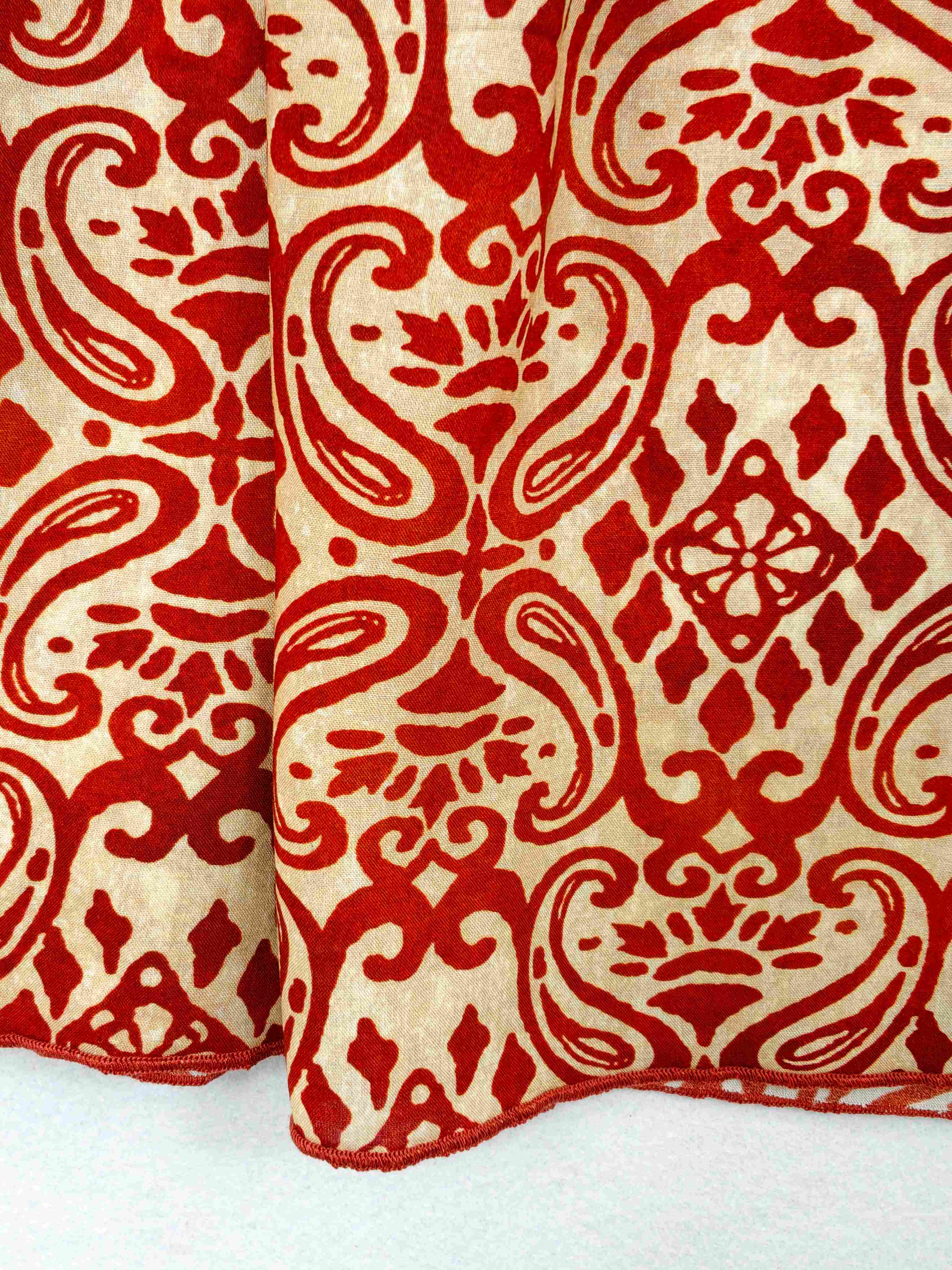 Ornamental print pattern and ruffle edge close-up