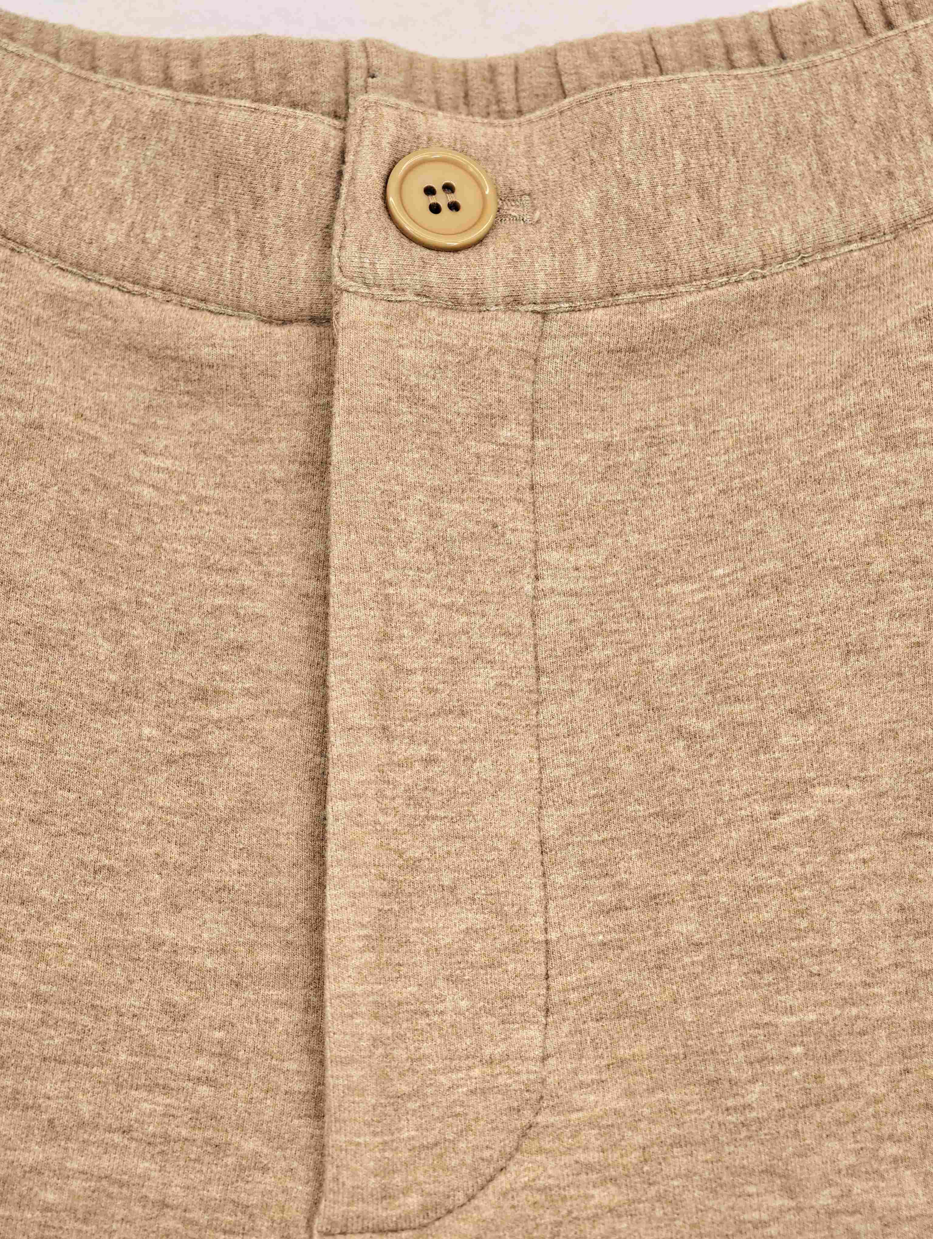 Button waistband and concealed front fly construction detail