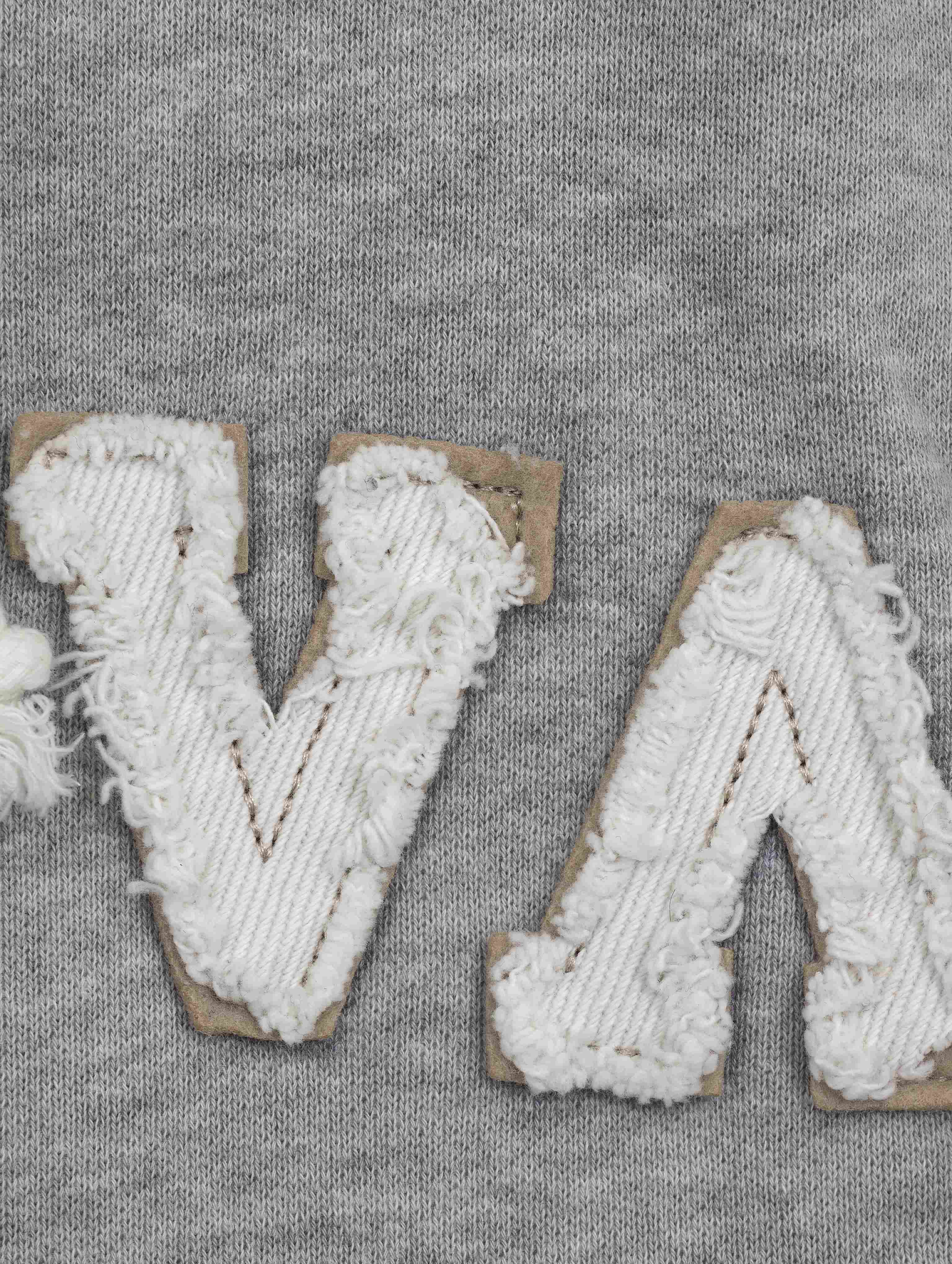 Textured chenille chest appliqué with contrast backing
