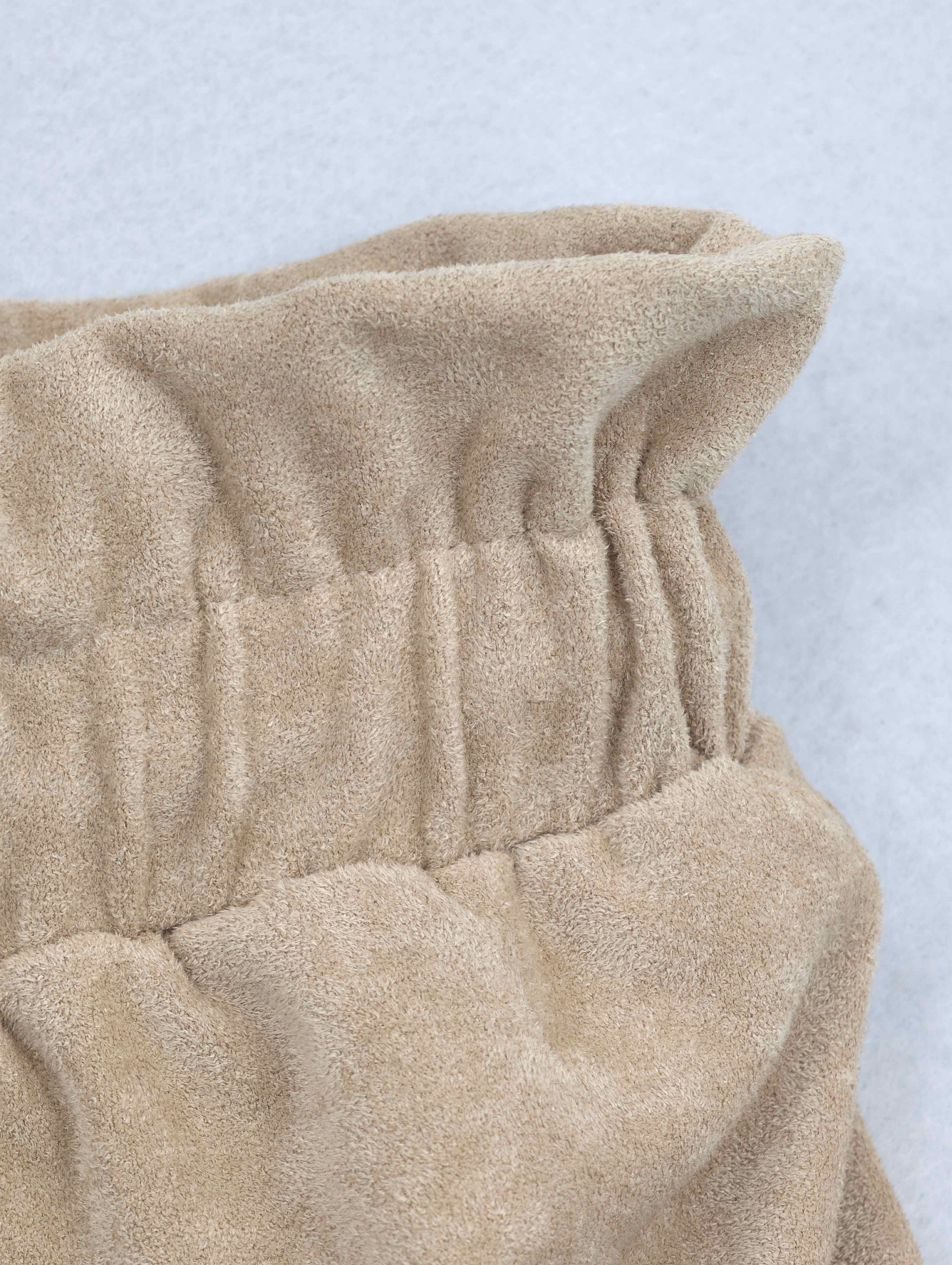 Gathered waist construction on brushed stretch fabric
